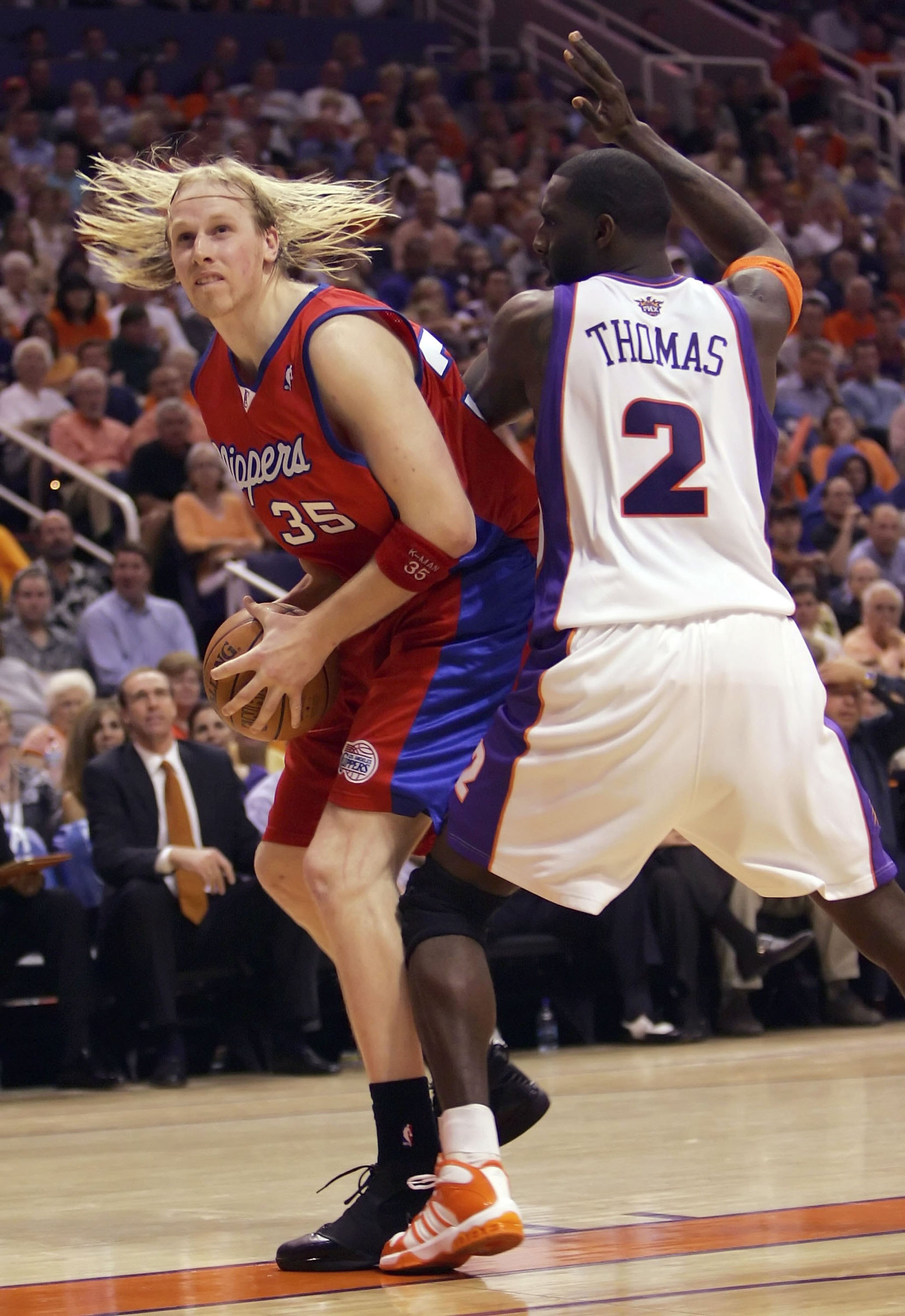 PHOENIX - MAY 8: Chris Kaman #35 of the Los Angeles Clippers drives against Tim Thomas #2 of the Phoenix Suns in game one of the Western Conference Semifinals during the 2006 NBA Playoffs on May 8, 2006 at US Airways Arena in Phoenix, Arizona. NOTE T PHOENIX - MAY 8: Chris Kaman #35 of the Los Angeles Clippers drives against Tim Thomas #2 of the Phoenix Suns in game one of the Western Conference Semifinals during the 2006 NBA Playoffs on May 8, 2006 at US Airways Arena in Phoenix, Arizona. NOTE T