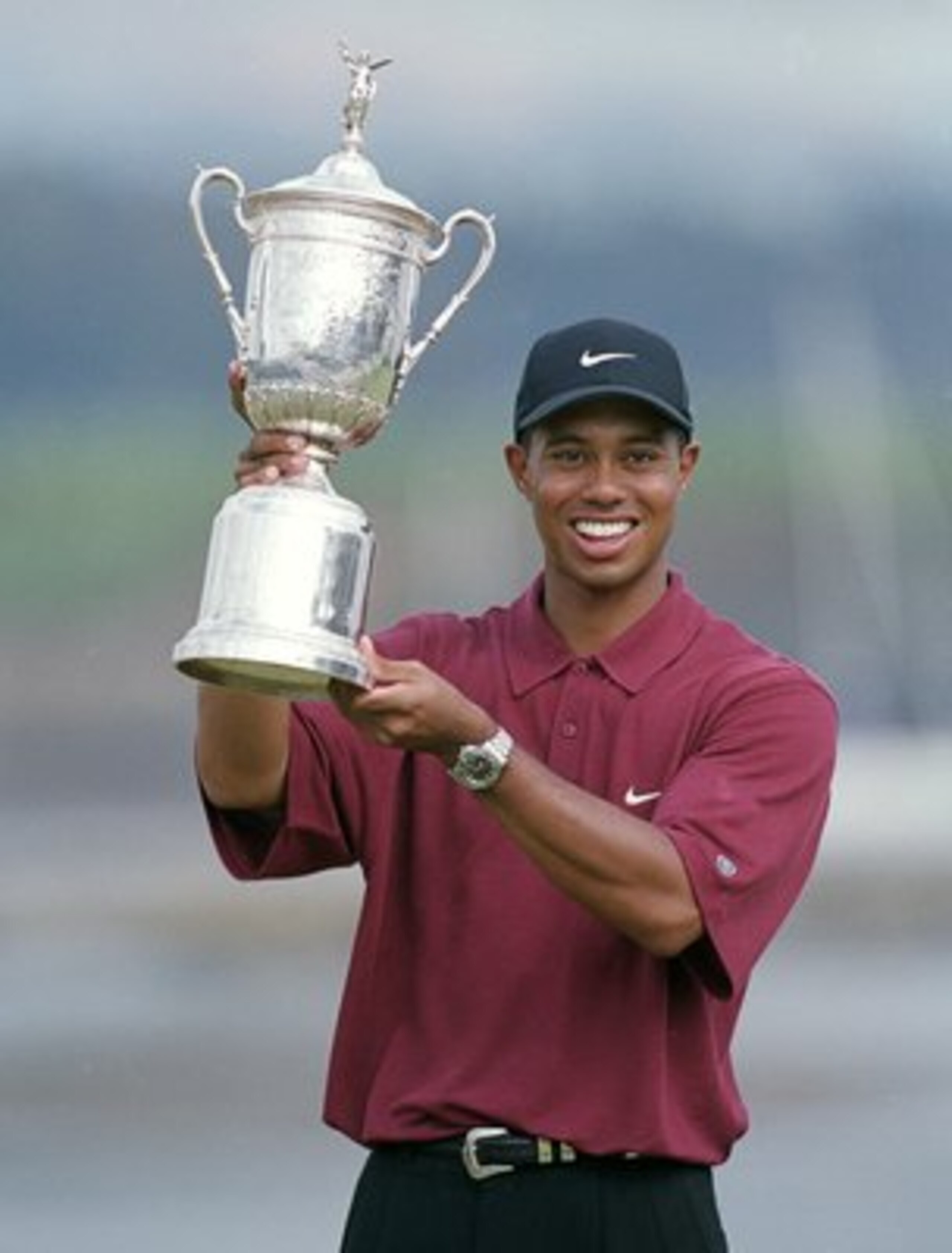 18 Jun 2000:  Tiger Woods poses with his trophy after winning the 100th US Open at the Pebble Beach Golf Links in Pebble Beach, California.Mandatory Credit: Jamie Squire  /Allsport