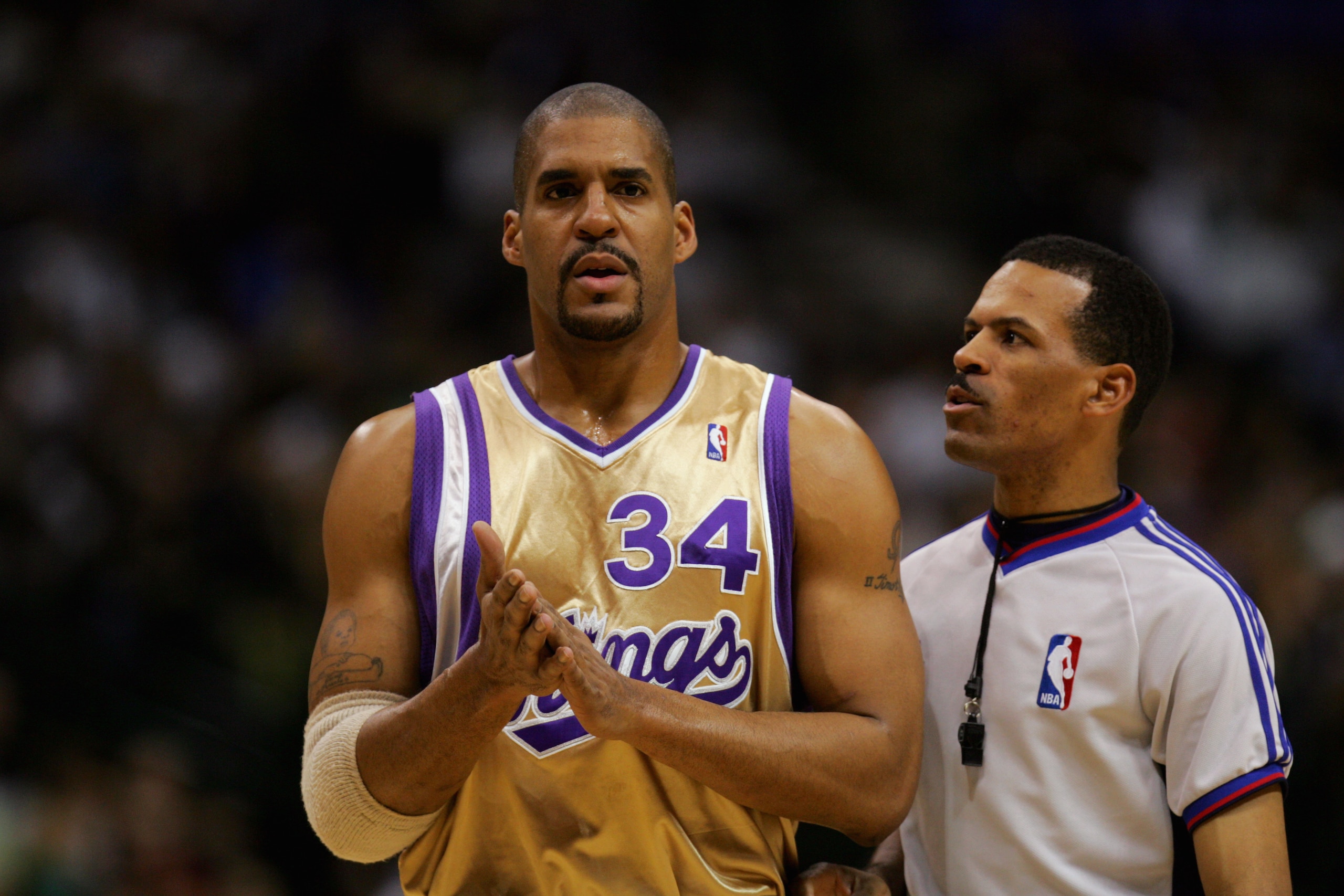 DALLAS - JANUARY 27:  NBA official Eric Lewis talks with Corliss Williamson #34 of the Sacramento Kings during a game against the Dallas Mavericks at the American Airlines Center on January 27, 2007 in Dallas, Texas.  The Mavs won 106-104.  (Photo by Rona