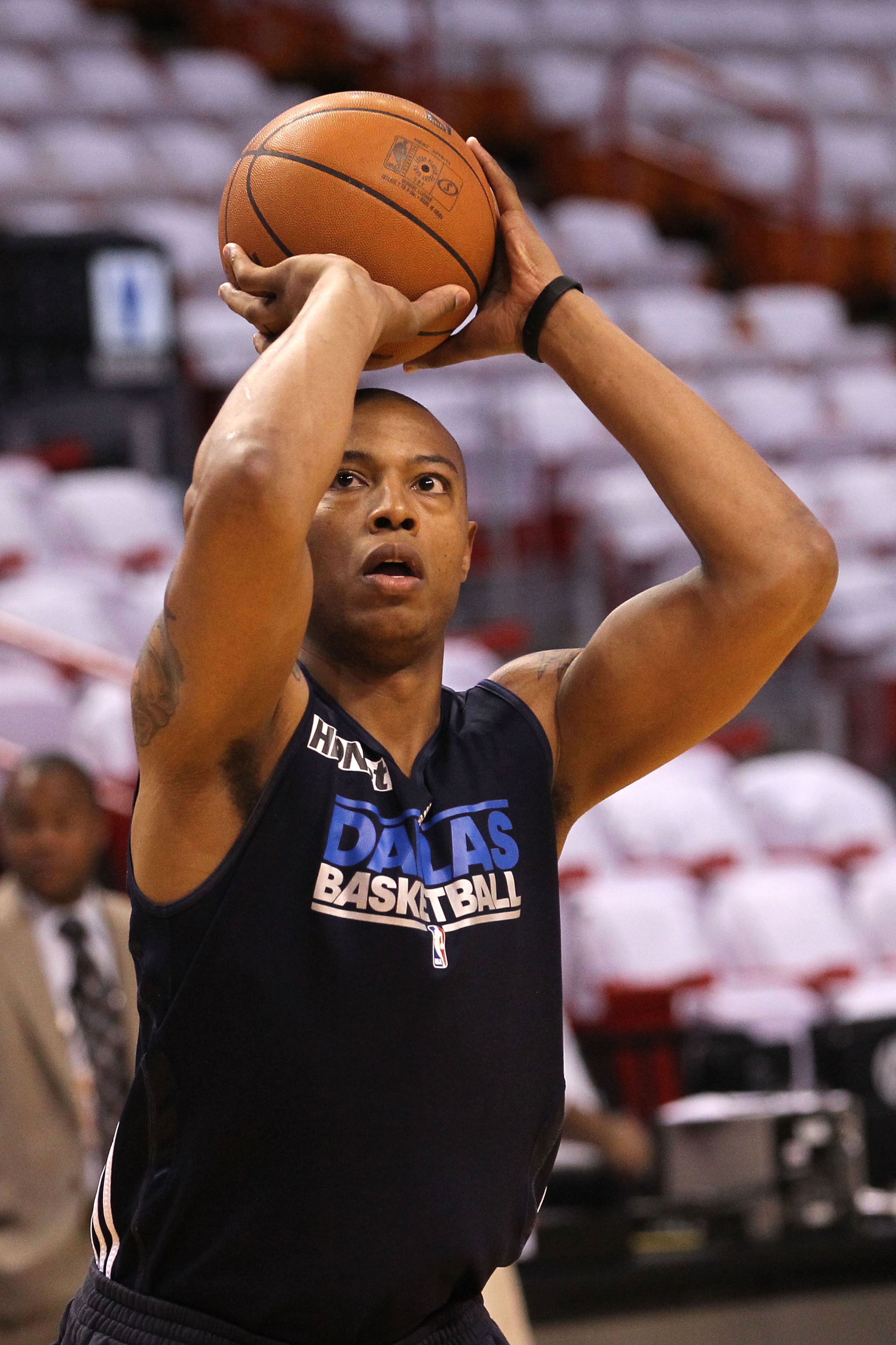 MIAMI, FL - MAY 31: Caron Butler #4 of the Dallas Mavericks shoots before Game One of the 2011 NBA Finals against the Miami Heat at American Airlines Arena on May 31, 2011 in Miami, Florida. Butler is on the inactive roster. NOTE TO USER: User expressly MIAMI, FL - MAY 31: Caron Butler #4 of the Dallas Mavericks shoots before Game One of the 2011 NBA Finals against the Miami Heat at American Airlines Arena on May 31, 2011 in Miami, Florida. Butler is on the inactive roster. NOTE TO USER: User expressly