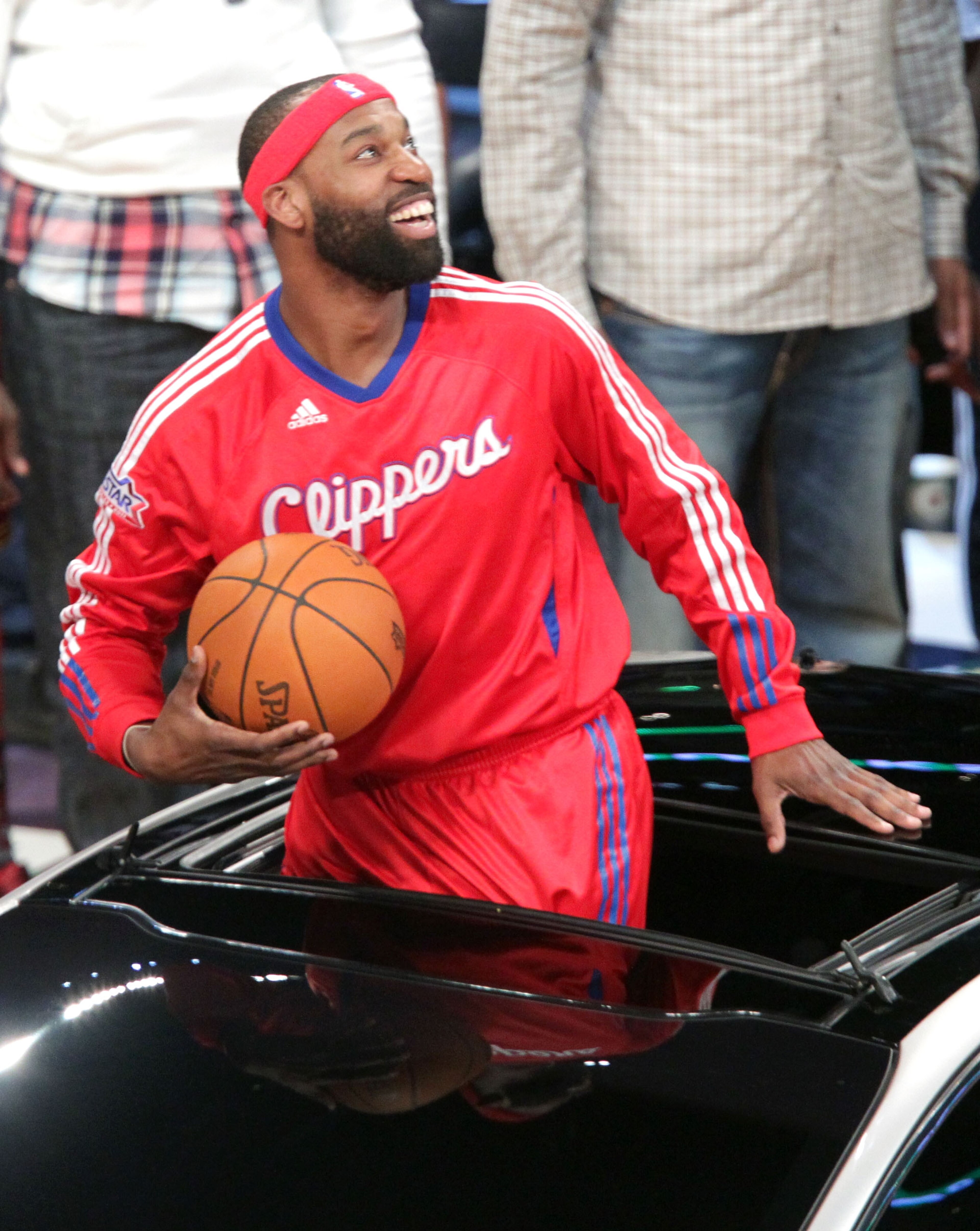 LOS ANGELES, CA - FEBRUARY 19: NBA player Baron Davis of the L.A. Clippers passes the ball from inside the car to teammate, Blake Griffin, and he attempts a slam dunk, during the Sprite Slam Dunk Contest apart of NBA All-Star Saturday Night at Staples Ce LOS ANGELES, CA - FEBRUARY 19: NBA player Baron Davis of the L.A. Clippers passes the ball from inside the car to teammate, Blake Griffin, and he attempts a slam dunk, during the Sprite Slam Dunk Contest apart of NBA All-Star Saturday Night at Staples Ce