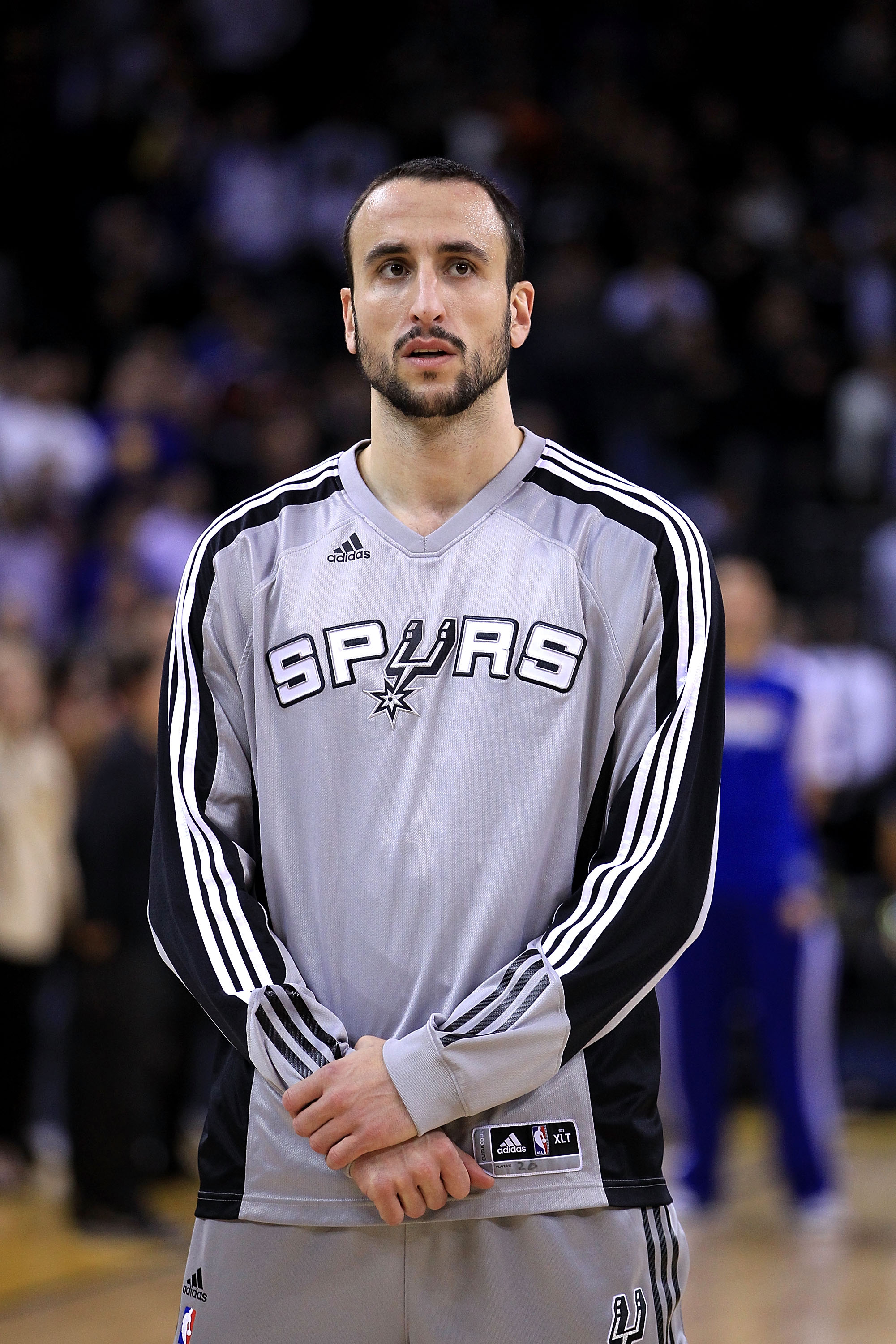 OAKLAND, CA - JANUARY 24:  Manu Ginobili #20 of the San Antonio Spurs stands for the National Anthem before their game against the Golden State Warriors at Oracle Arena on January 24, 2011 in Oakland, California.  NOTE TO USER: User expressly acknowledges