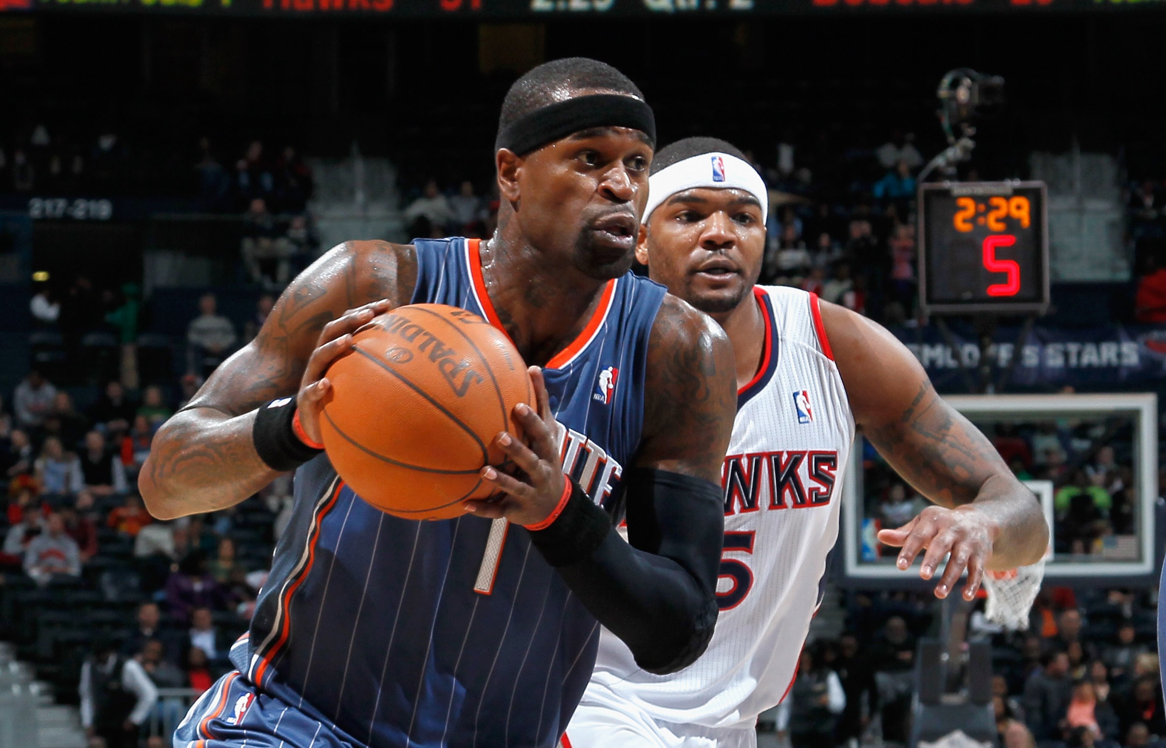 ATLANTA, GA - FEBRUARY 12: Stephen Jackson #1 of the Charlotte Bobcats drives past Josh Smith #5 of the Atlanta Hawks at Philips Arena on February 12, 2011 in Atlanta, Georgia. NOTE TO USER: User expressly acknowledges and agrees that, by downloading an ATLANTA, GA - FEBRUARY 12: Stephen Jackson #1 of the Charlotte Bobcats drives past Josh Smith #5 of the Atlanta Hawks at Philips Arena on February 12, 2011 in Atlanta, Georgia. NOTE TO USER: User expressly acknowledges and agrees that, by downloading an
