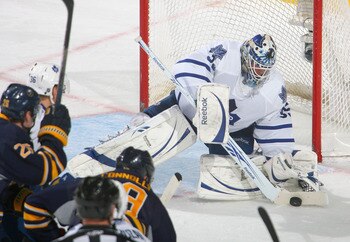 BUFFALO, NY - FEBRUARY 16: Jean-Sebastien Giguere #35 of the Toronto Maple Leafs covers up on a shot by Tim Connolly #19 of the Buffalo Sabres  at HSBC Arena on February 16, 2011 in Buffalo, New York.  (Photo by Rick Stewart/Getty Images)
