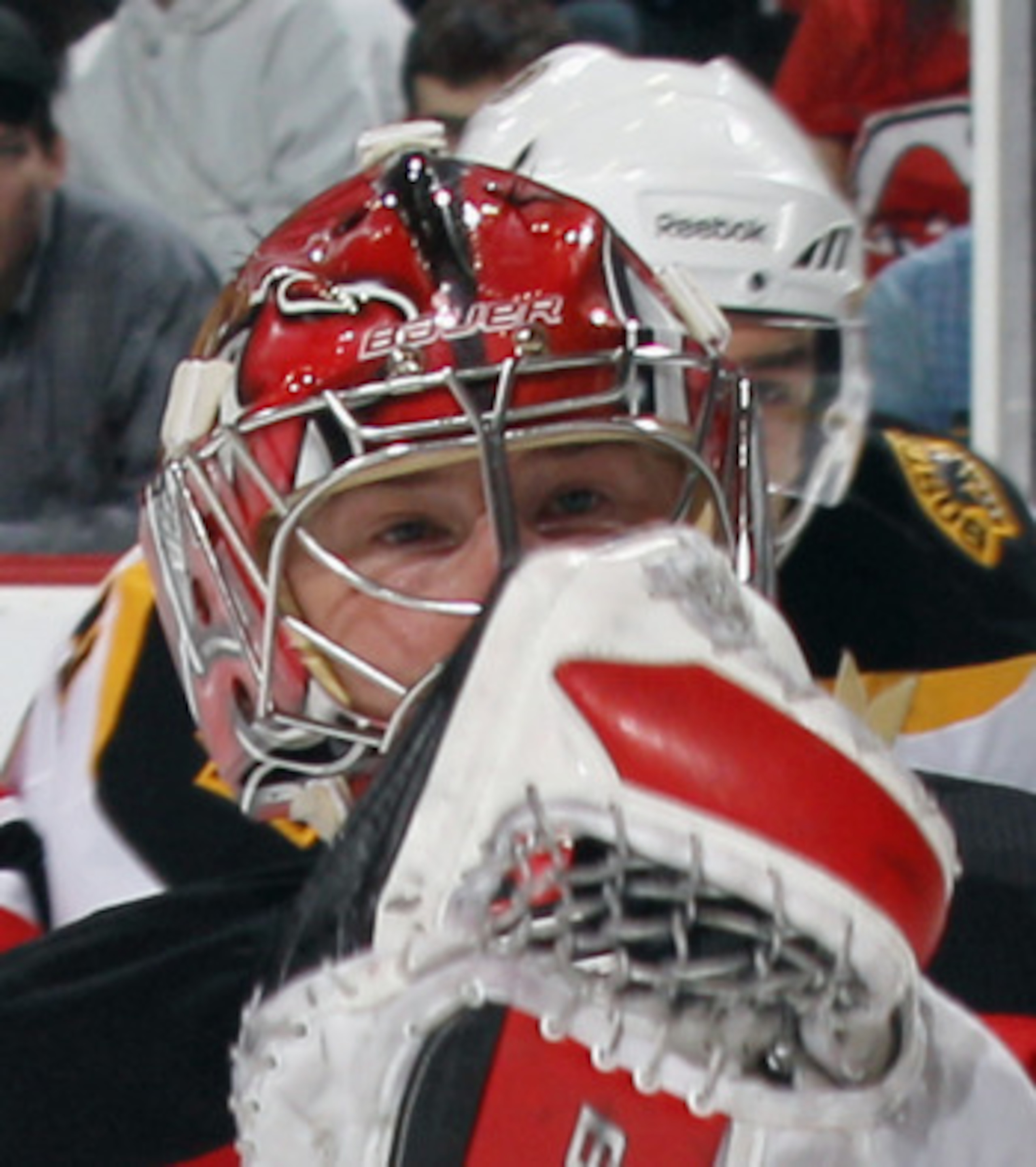 NEWARK, NJ - APRIL 10: Johan Hedberg #1 of the New Jersey Devils comes up with teh puck in his game against the Boston Bruins at the Prudential Center on April 10, 2011 in Newark, New Jersey.  (Photo by Bruce Bennett/Getty Images)