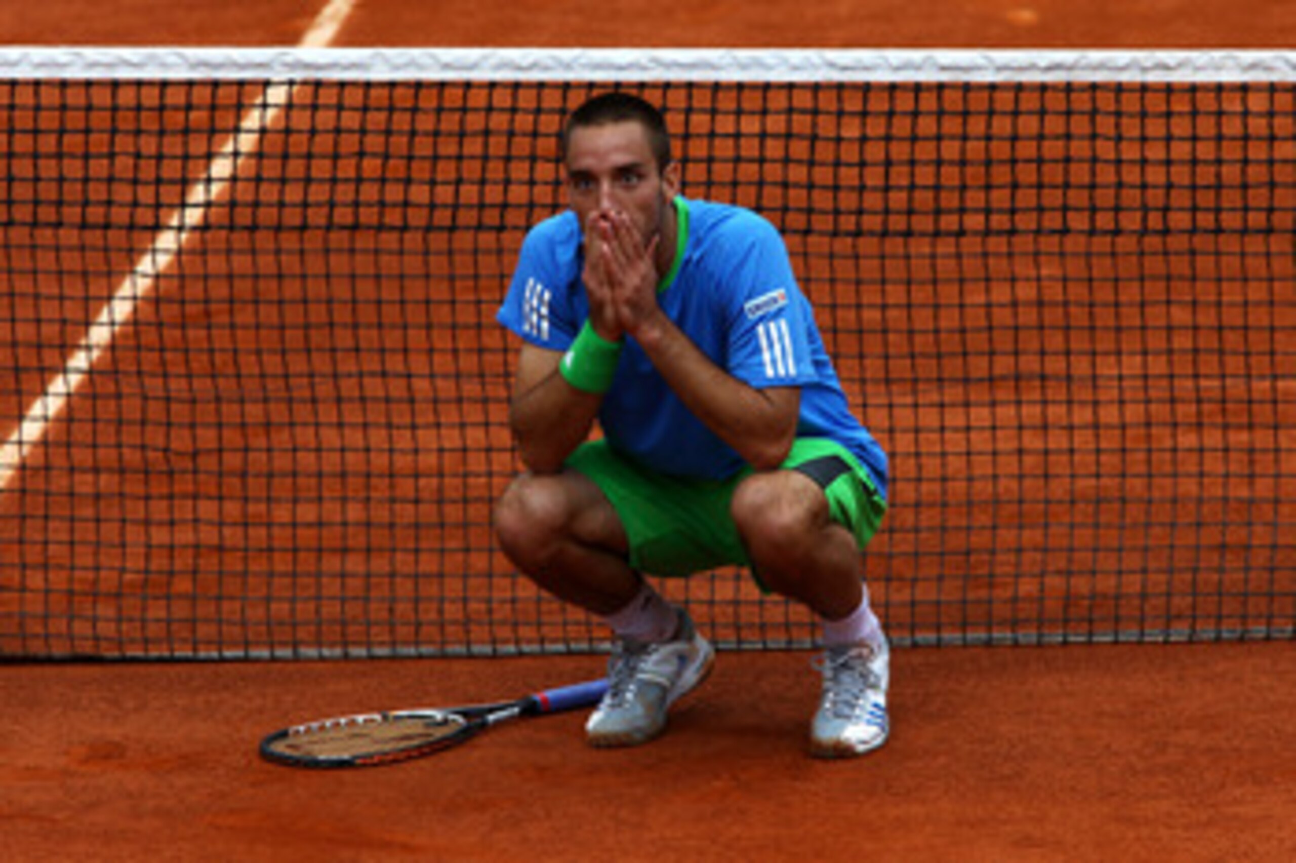PARIS, FRANCE - MAY 31:  Viktor Troicki of Serbia disputes a call by the Umpire after a ball bay ran onto the court whilst a point was still in play during the men's singles round four match between Andy Murray of Great Britain and Viktor Troicki of Serbi