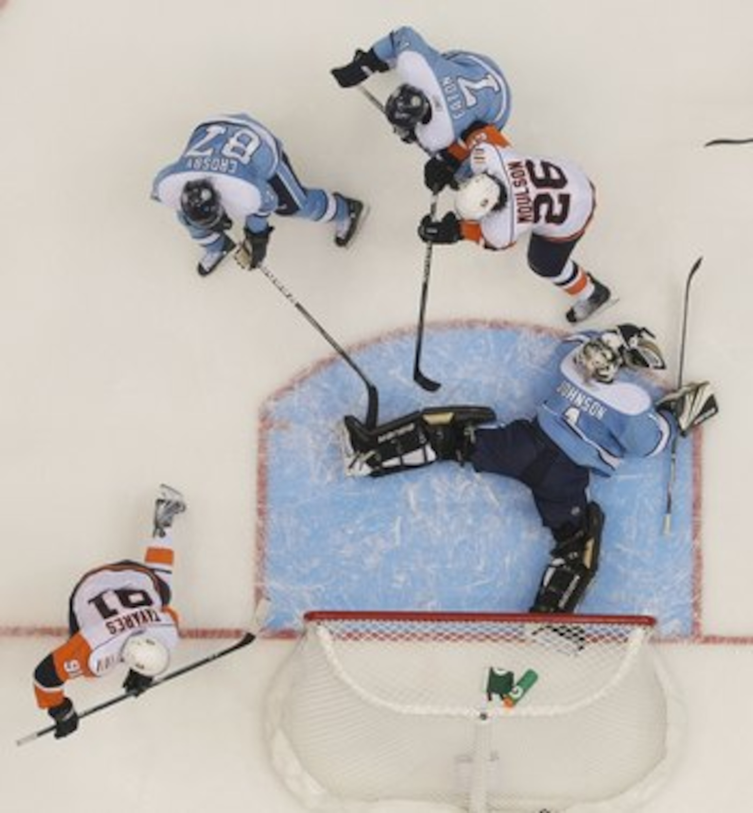 UNIONDALE, NY - NOVEMBER 27:  Brent Johnson #1 of the Pittsburgh Penguins tends net against Matt Moulson #26 and John Tavares #91 of the New York Islanders at the Nassau Coliseum on November 27, 2009 in Uniondale, New York.  (Photo by Bruce Bennett/Getty 