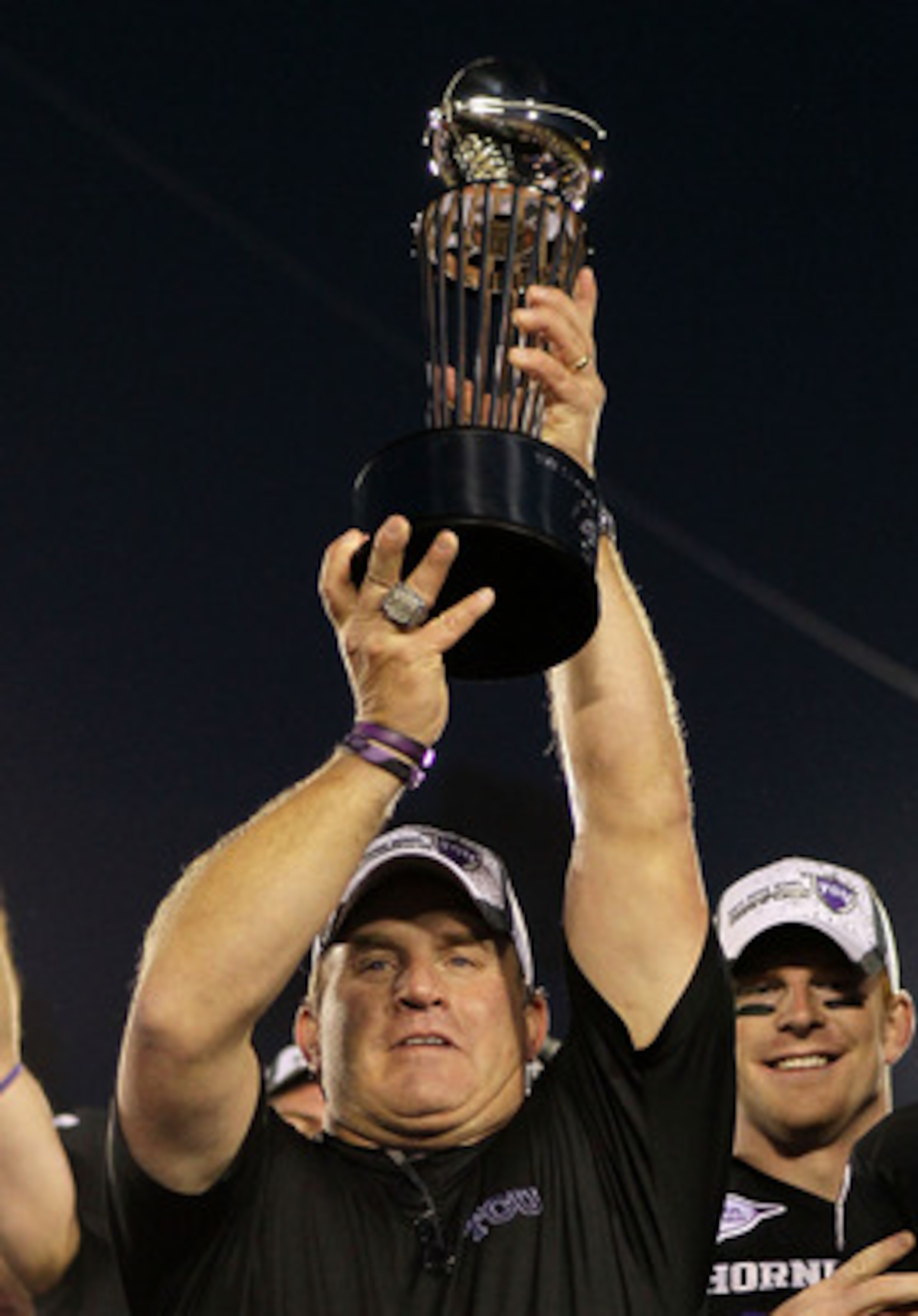 PASADENA, CA - JANUARY 01:  Head coach Gary Patterson of the TCU Horned Frogs holds the Rose Bowl Championship Trophy after defeating the Wisconsin Badgers 21-19 in the 97th Rose Bowl game on January 1, 2011 in Pasadena, California.  (Photo by Jeff Gross/
