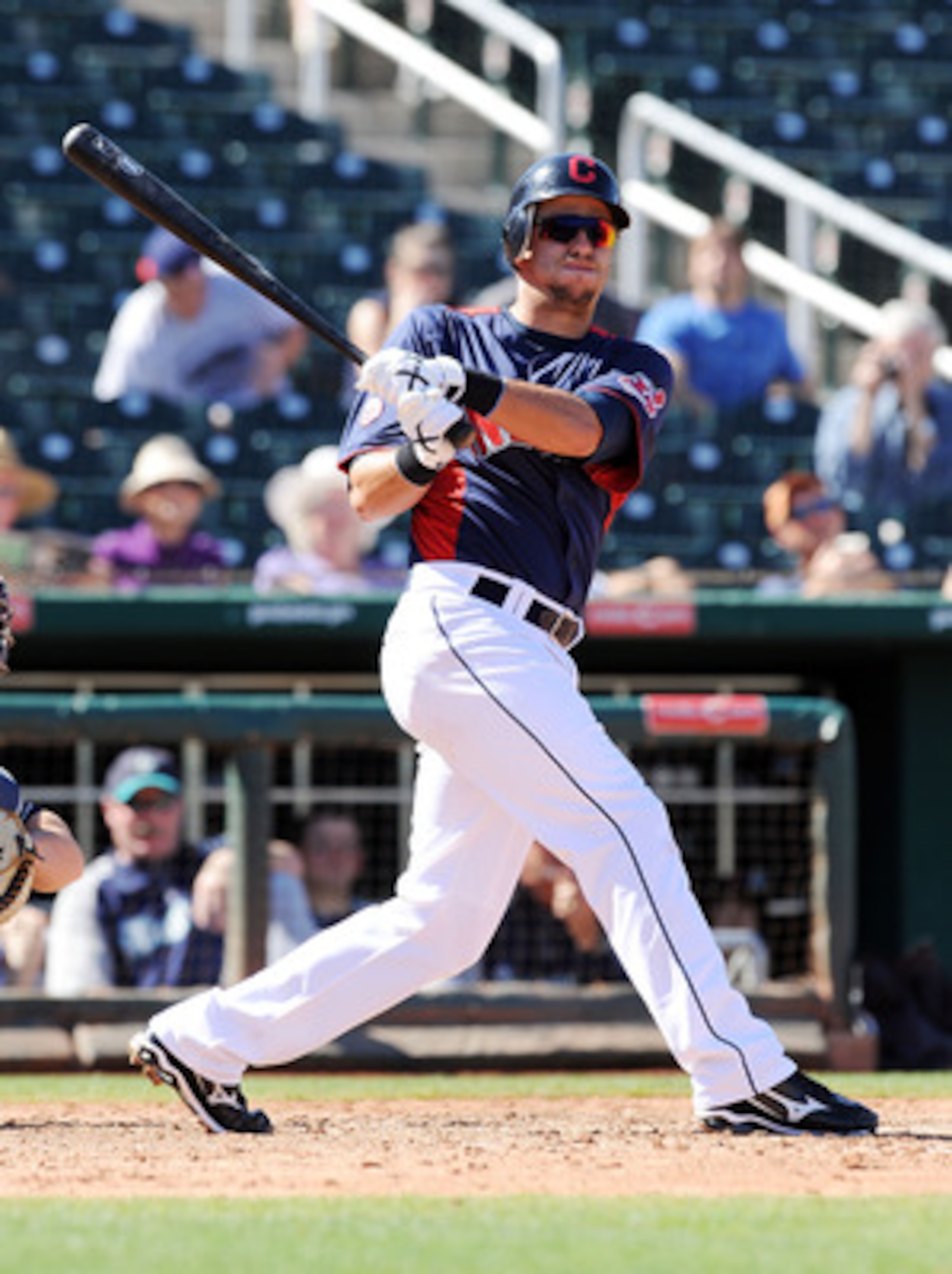 GOODYEAR, AZ - MARCH 11:  Lonnie Chisenhall #76 of the Cleveland Indians follows through on a swing against the Seattle Mariners at Goodyear Ballpark on March 11, 2011 in Goodyear, Arizona.  (Photo by Norm Hall/Getty Images)
