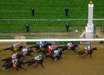 LOUISVILLE, KY - MAY 07:  The pack of horses races past the finish line during the 137th Kentucky Derby at Churchill Downs on May 7, 2011 in Louisville, Kentucky.  (Photo by Jamie Squire/Getty Images)