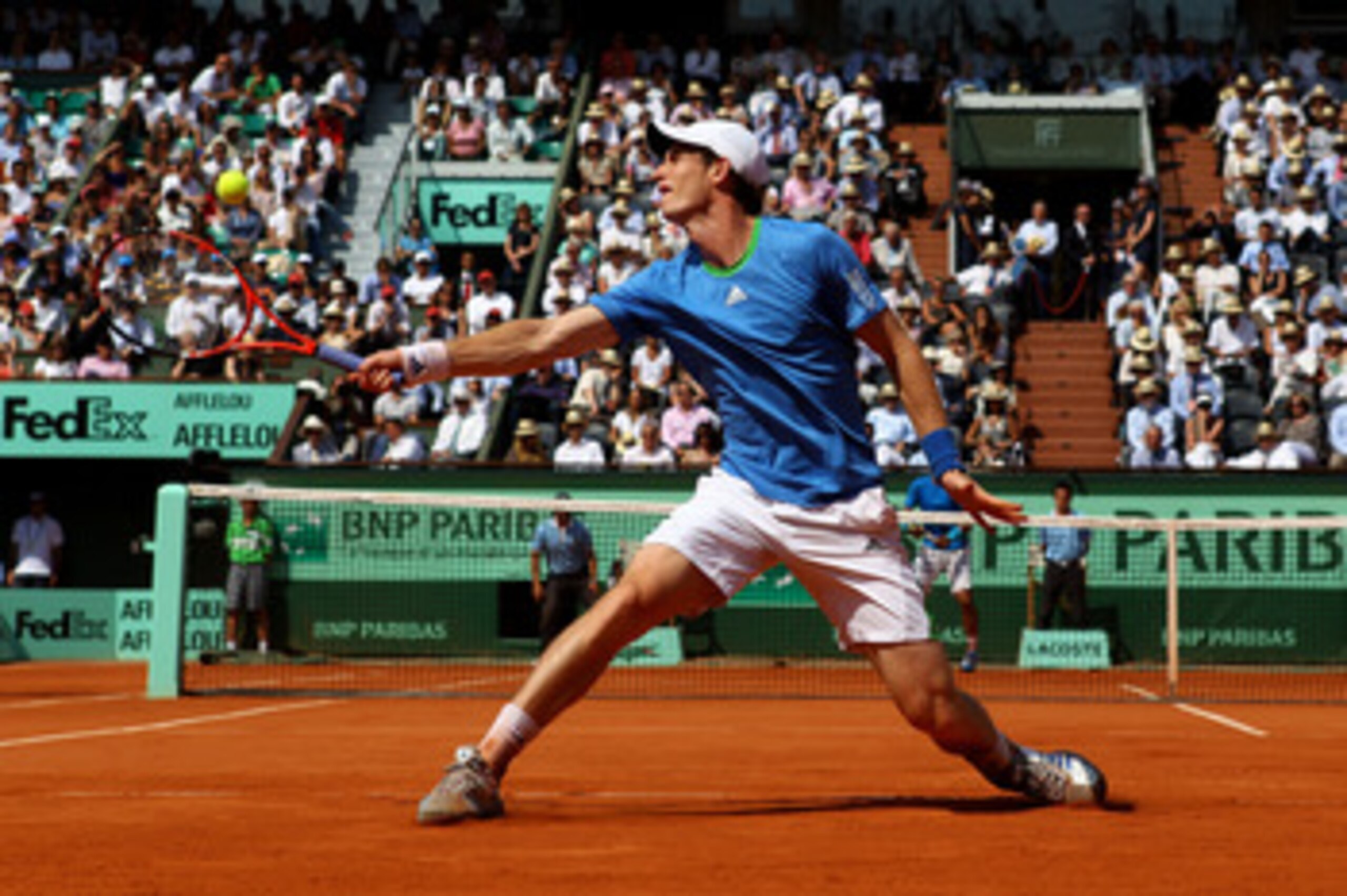 PARIS, FRANCE - JUNE 03:  Andy Murray of Great Britain hits a backhand during the men's singles semi final match between Rafael Nadal of Spain and Andy Murray of Great Britain on day thirteen of the French Open at Roland Garros on June 3, 2011 in Paris, F
