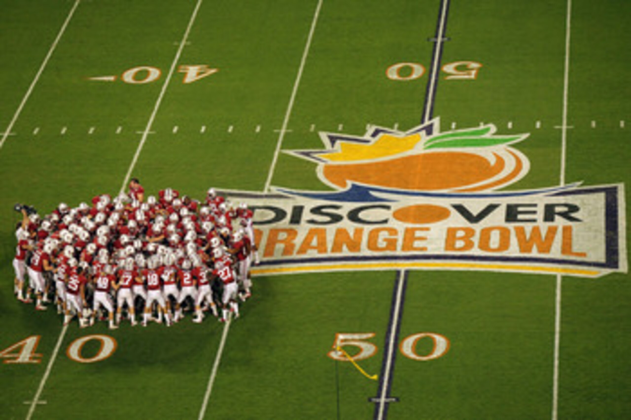 MIAMI, FL - JANUARY 03:  The Stanford Cardinal huddle on the field prior to playing against the Virginia Tech Hokies during the 2011 Discover Orange Bowl at Sun Life Stadium on January 3, 2011 in Miami, Florida. Stanford won 40-12.  (Photo by Mike Ehrmann