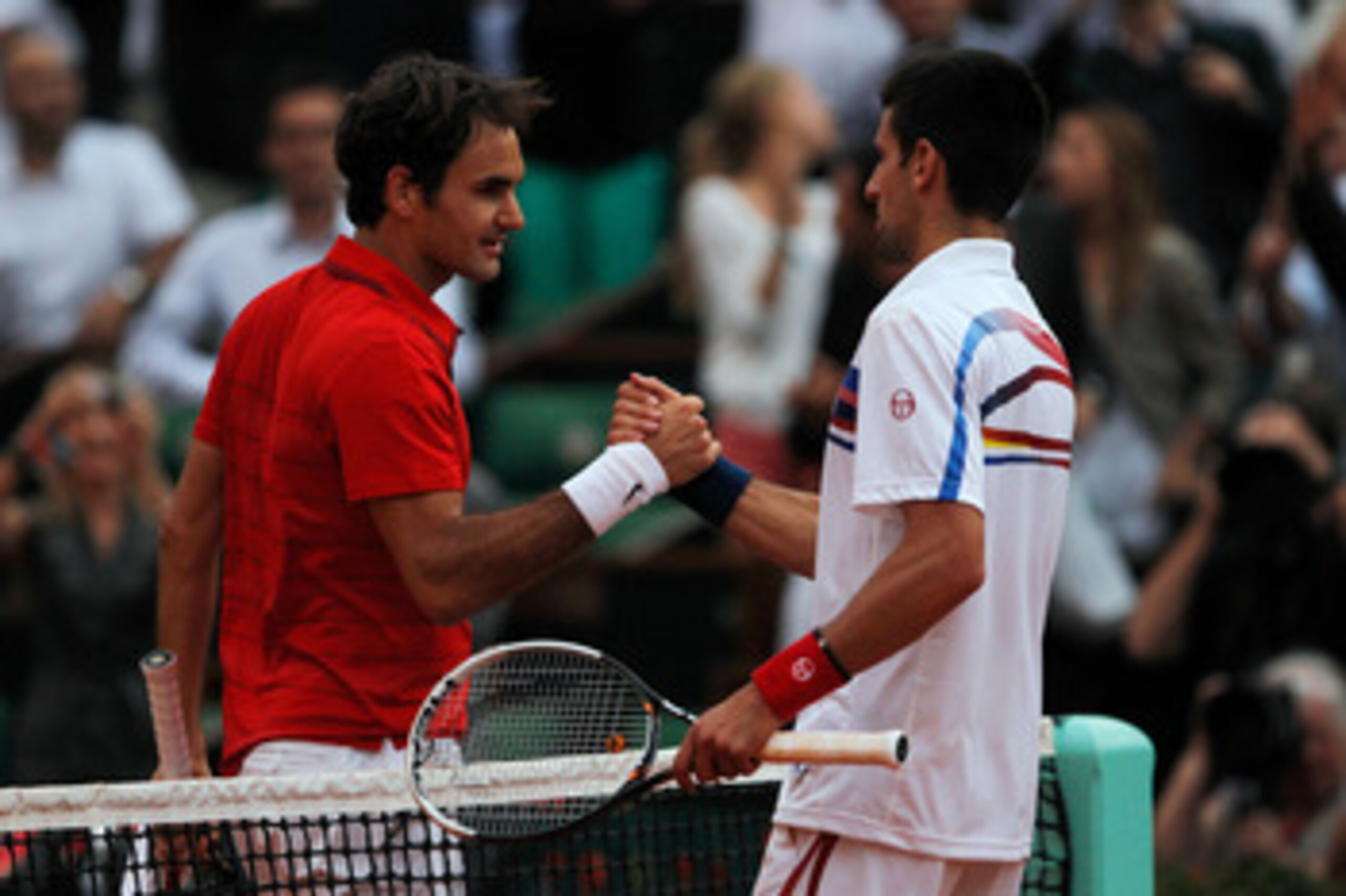 PARIS, FRANCE - JUNE 03:  Roger Federer of Switzerland is congratulated by Novak Djokovic of Serbia following his victory during the men's singles semi final match between Roger Federer of Switzerland and Novak Djokovic of Serbia on day thirteen of the Fr