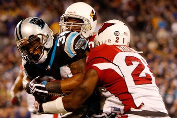 CHARLOTTE, NC - JANUARY 10:  DeAngelo Williams #34 of the Carolina Panthers runs with the ball against  the Arizona Cardinals during the NFC Divisional Playoff Game on January 10, 2009 at Bank of America Stadium in Charlotte, North Carolina. The Arizona C