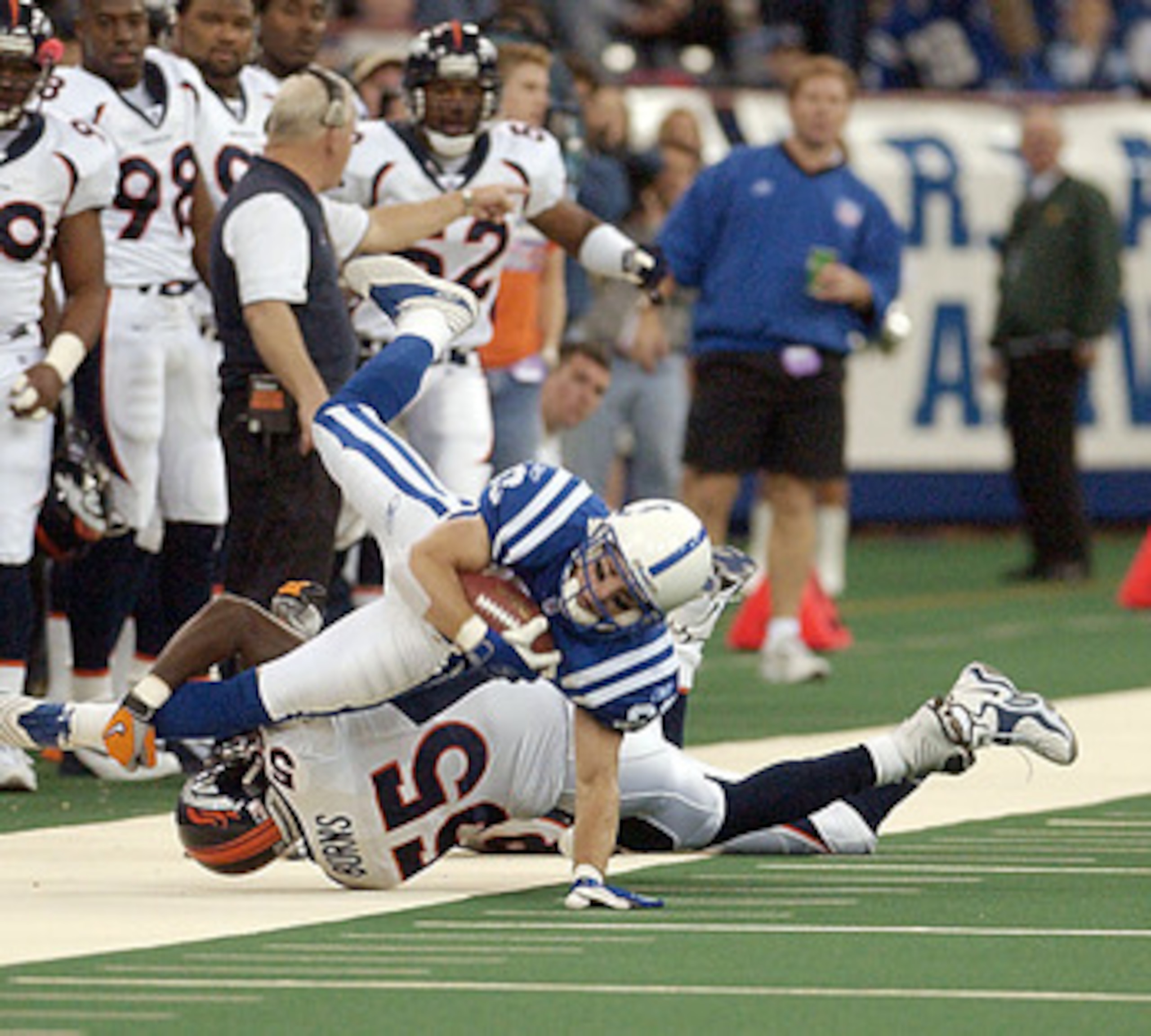 06 Jan 2002: Trevor Insley #83 of the Indianapolis Colts gets knocked out of bounds by Keith Burns #55 of the Denver Broncos during their NFL game at the RCA Dome in Indianapolis on Sunday. Mandatory Credit: Ron Hoskins\\Getty Images 06 Jan 2002: Trevor Insley #83 of the Indianapolis Colts gets knocked out of bounds by Keith Burns #55 of the Denver Broncos during their NFL game at the RCA Dome in Indianapolis on Sunday. Mandatory Credit: Ron Hoskins\\Getty Images
