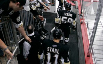 PITTSBURGH, PA - APRIL 23:  Jordan Staal #11, Kris Letang #58, and Brent Johnson #1 of the Pittsburgh Penguins take the ice for warm ups before the start of Game Five of the Eastern Conference Quarterfinals against the Tampa Bay Lightning during the 2011