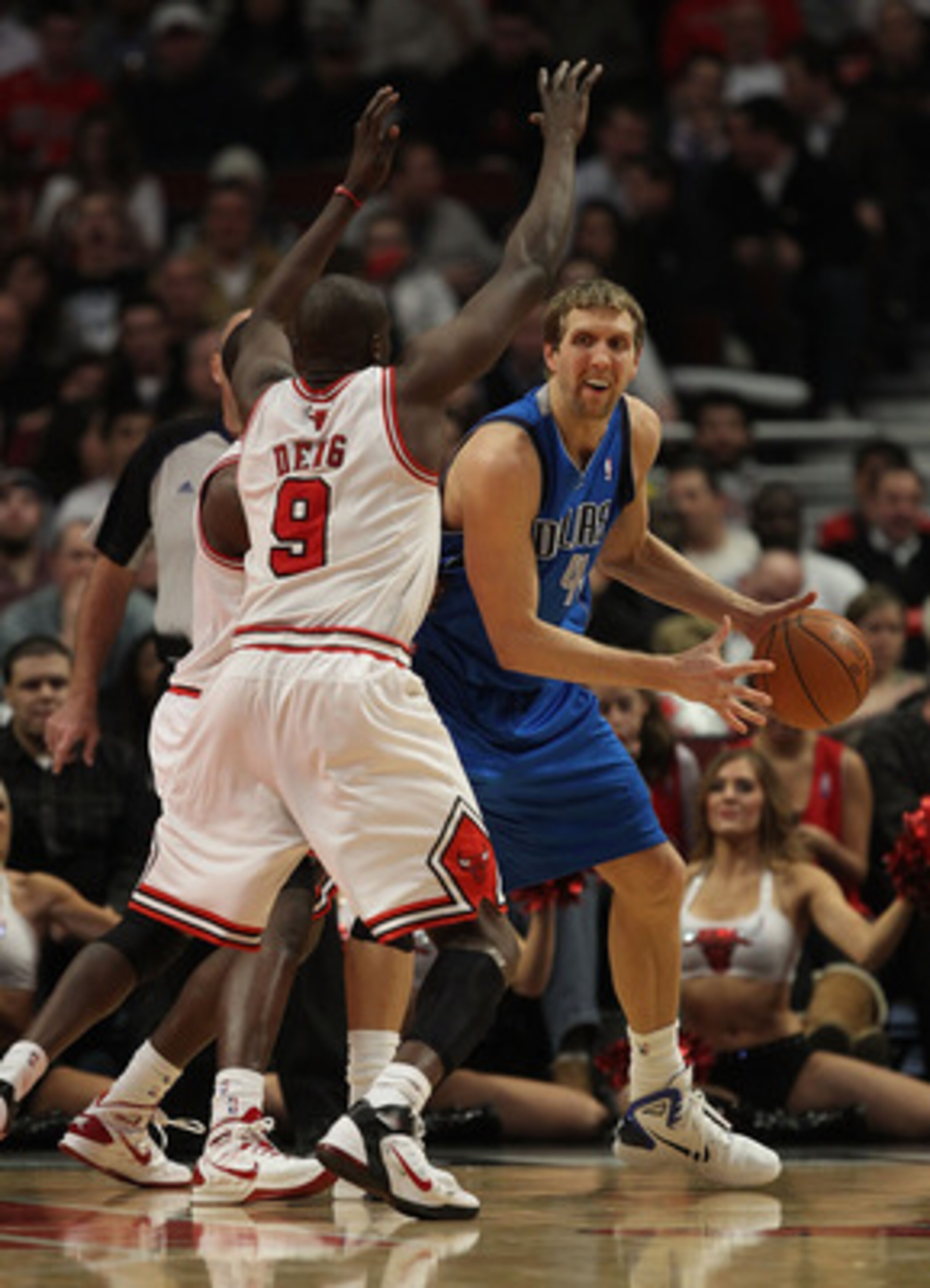 CHICAGO, IL - JANUARY 20: Dirk Nowitzki #41 of the Dallas Mavericks looks to pass under pressure from Ronnie Brewer #11 and Loul Deng #9 of the Chicago Bulls at the United Center on January 20, 2011 in Chicago, Illinois. The Bulls defeated the Mavericks 8
