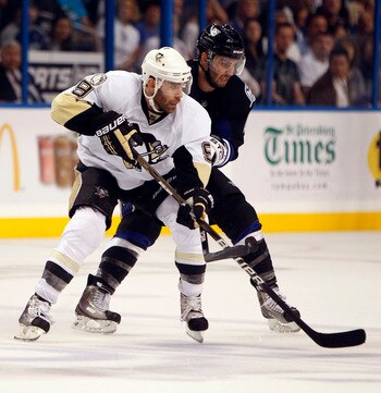 TAMPA, FL - APRIL 25: Pascal Dupuis #9 of the Pittsburgh Penguins skates with the puck against Teddy Purcell #16 of the Tampa Bay Lightning in Game Six of the Eastern Conference Quarterfinals during the 2011 NHL Stanley Cup Playoffs at the St. Pete Times