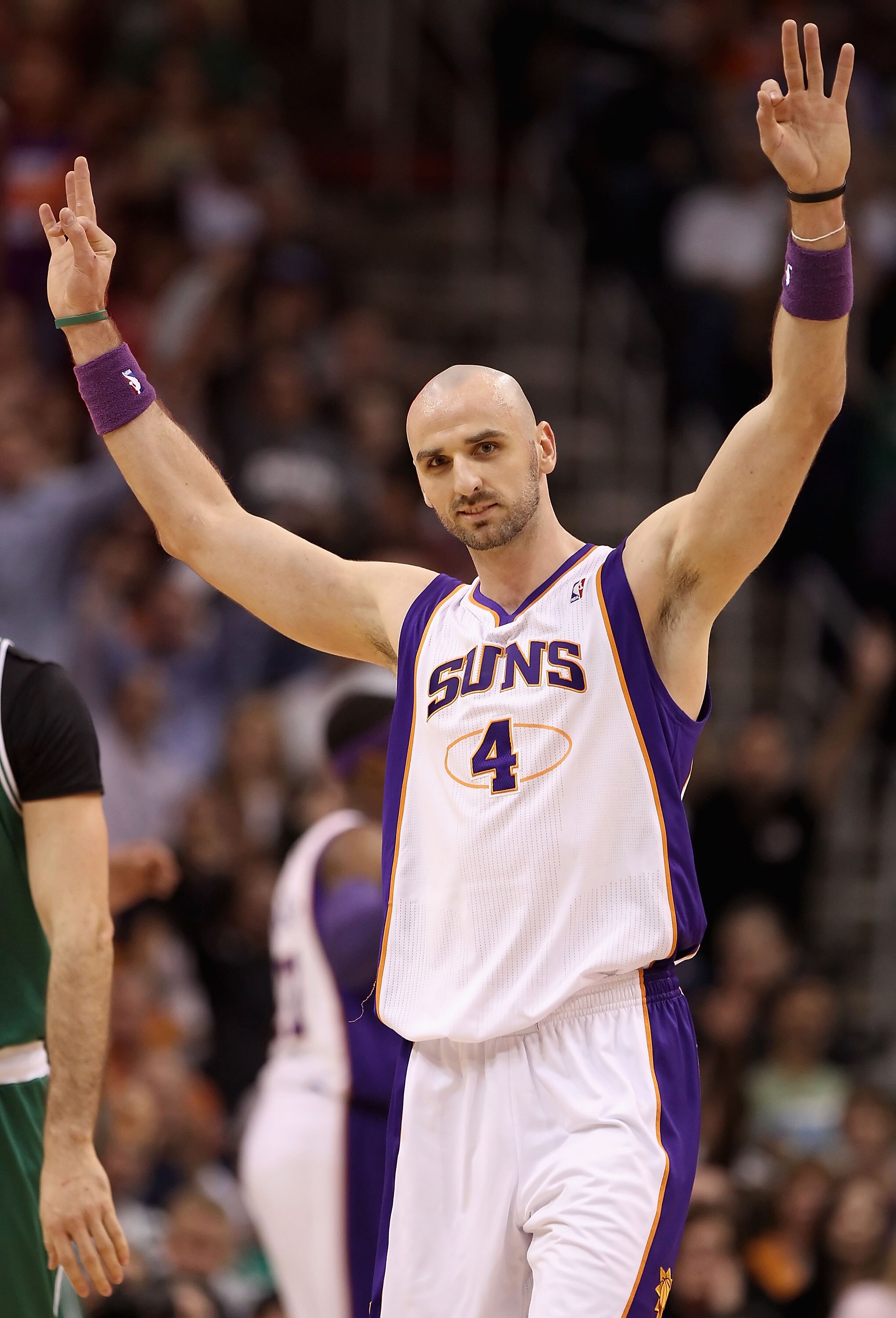 PHOENIX, AZ - JANUARY 28: Marcin Gortat #4 of the Phoenix Suns reacts after hitting a three point shot at the end of the first quarter against the Boston Celtics during the NBA game at US Airways Center on January 28, 2011 in Phoenix, Arizona. The Suns d PHOENIX, AZ - JANUARY 28: Marcin Gortat #4 of the Phoenix Suns reacts after hitting a three point shot at the end of the first quarter against the Boston Celtics during the NBA game at US Airways Center on January 28, 2011 in Phoenix, Arizona. The Suns d