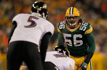 GREEN BAY, WI - DECEMBER 07: Nick Barnett #56 of the Green Bay Packers stares at Joe Flacco #5 of the Baltimore Ravens before the snap at Lambeau Field on December 7, 2009 in Green Bay, Wisconsin. The Packers defeated the Ravens 27-17. (Photo by Jonathan
