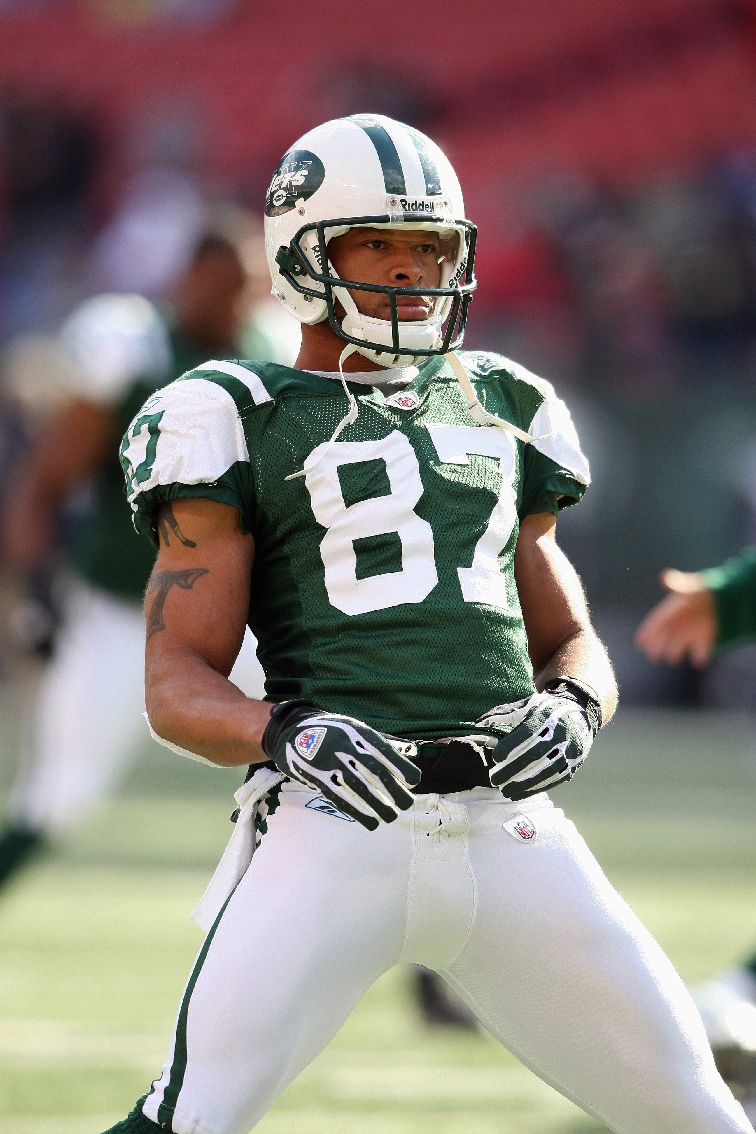 EAST RUTHERFORD, NJ - NOVEMBER 09: Laveranues Coles #87 of the New York Jets stretches in warmups against the St. Louis Rams at Giants Stadium on November 9, 2008 in East Rutherford, New Jersey. (Photo by Nick Laham/Getty Images)