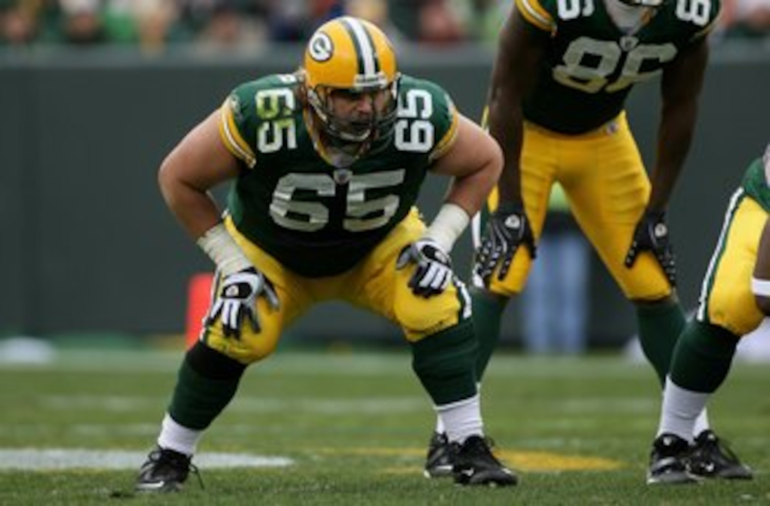 GREEN BAY, WI - NOVEMBER 16:  Offensive tackle Mark Tauscher #65 of the Green Bay Packers is ready to protect the line of scrimmage against the Chicago Bears during NFL action at Lambeau Field on November 16, 2008 in Green Bay, Wisconsin. The Packers defe