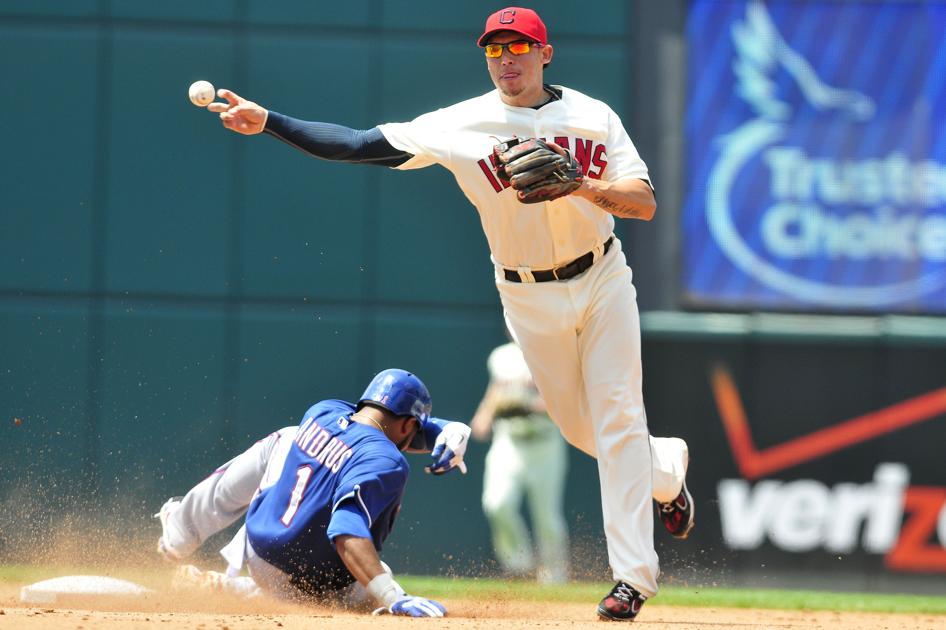 CLEVELAND, OH - JUNE 5: Elvis Andrus #1 of the Texas Rangers is out at second as Asdrubal Cabrera #13 of the Cleveland Indians turns a double play during the fifth inning at Progressive Field on June 5, 2011 in Cleveland, Ohio. (Photo by Jason Miller/Gett