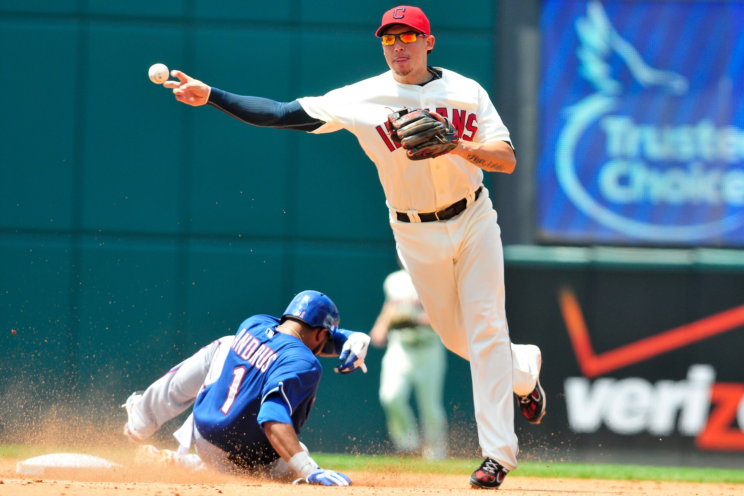 CLEVELAND, OH - JUNE 5: Elvis Andrus #1 of the Texas Rangers is out at second as Asdrubal Cabrera #13 of the Cleveland Indians turns a double play during the fifth inning at Progressive Field on June 5, 2011 in Cleveland, Ohio. (Photo by Jason Miller/Gett