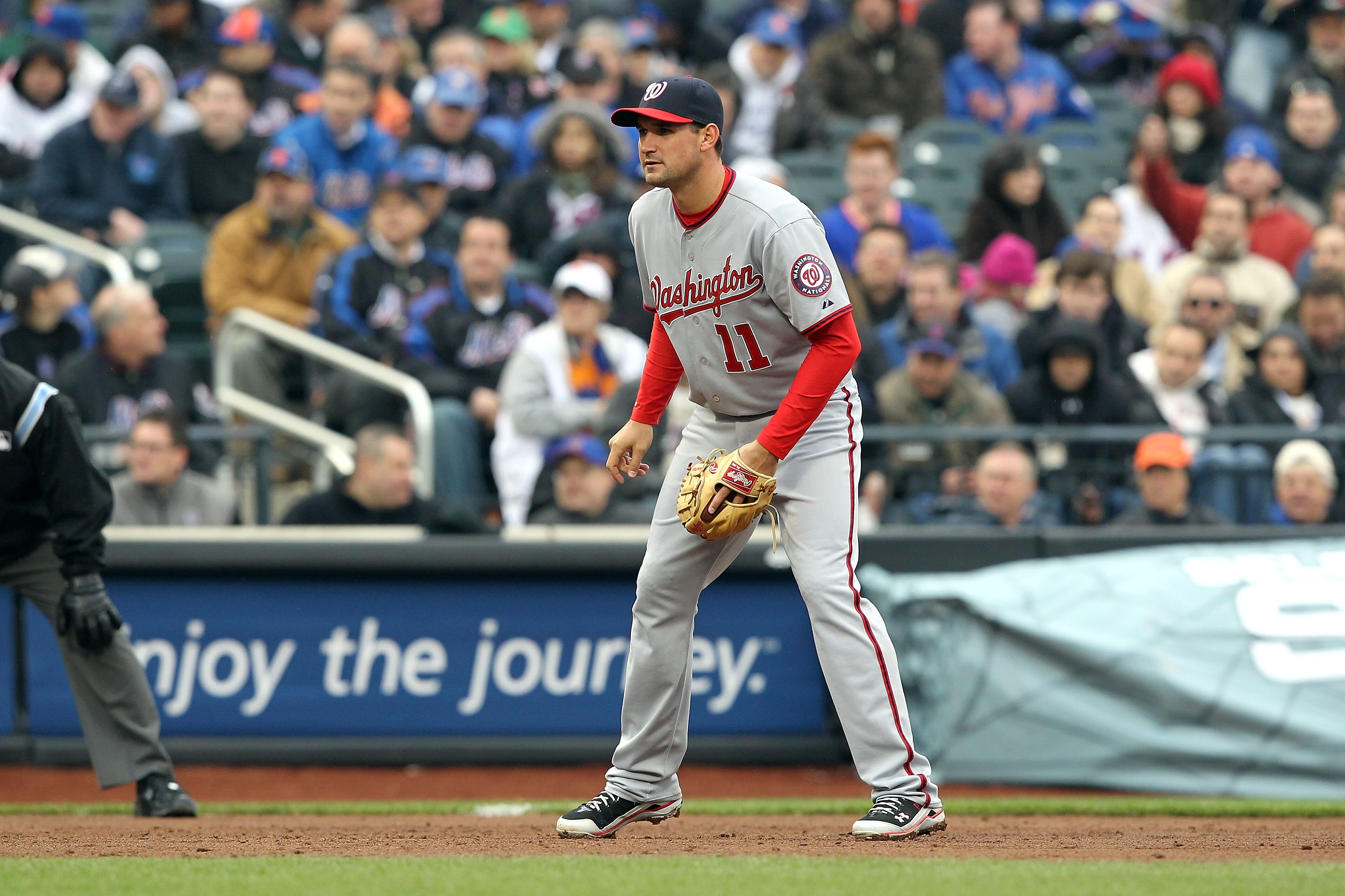 NEW YORK, NY - APRIL 08:  Ryan Zimmerman #11 of the Washington Nationals defends thirdbase against the New York Mets during the Mets' Home Opener at Citi Field on April 8, 2011 in the Flushing neighborhood of Queens in New York City. The Nationals won 6-2