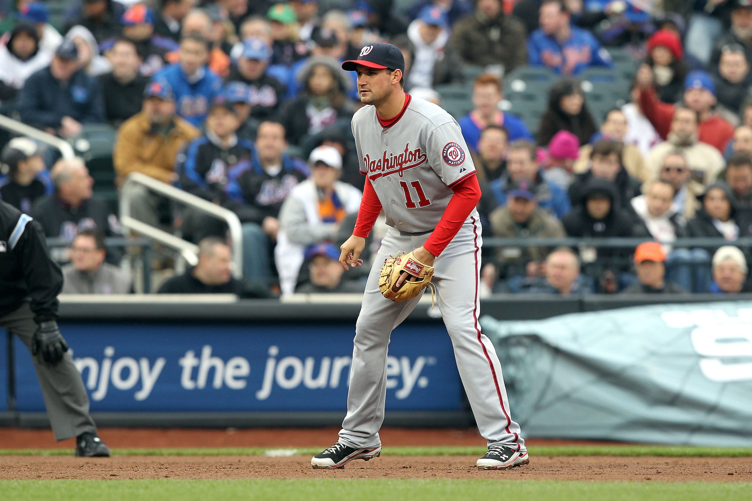 NEW YORK, NY - APRIL 08:  Ryan Zimmerman #11 of the Washington Nationals defends thirdbase against the New York Mets during the Mets' Home Opener at Citi Field on April 8, 2011 in the Flushing neighborhood of Queens in New York City. The Nationals won 6-2