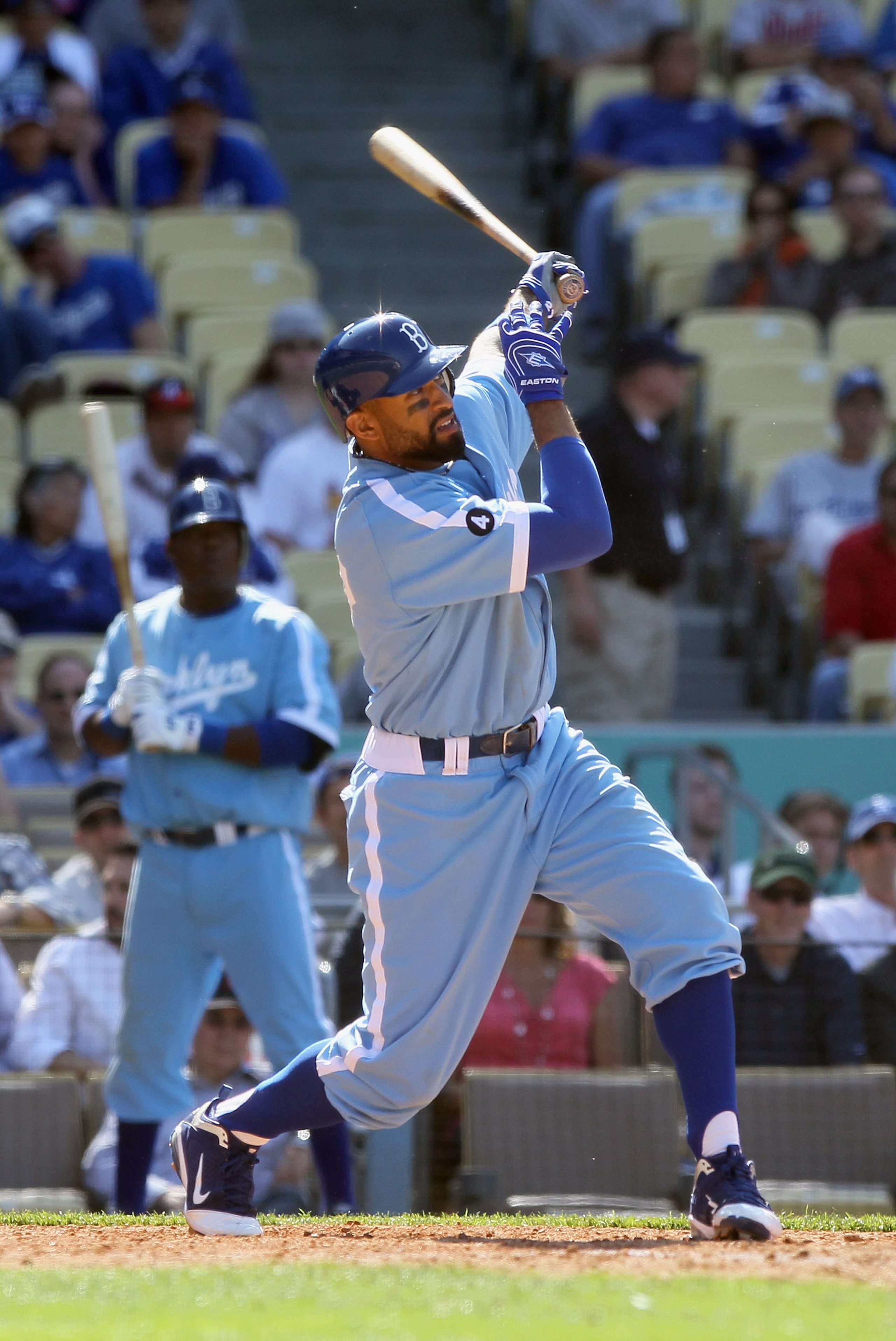 LOS ANGELES, CA - APRIL 21:  Matt Kemp #27 of the Los Angeles Dodgers hits a game winning two-run home run in the 12th inning against the Atlanta Braves at Dodger Stadium on April 21, 2011 in Los Angeles, California. The Dodgers defeated the Braves 5-3 in