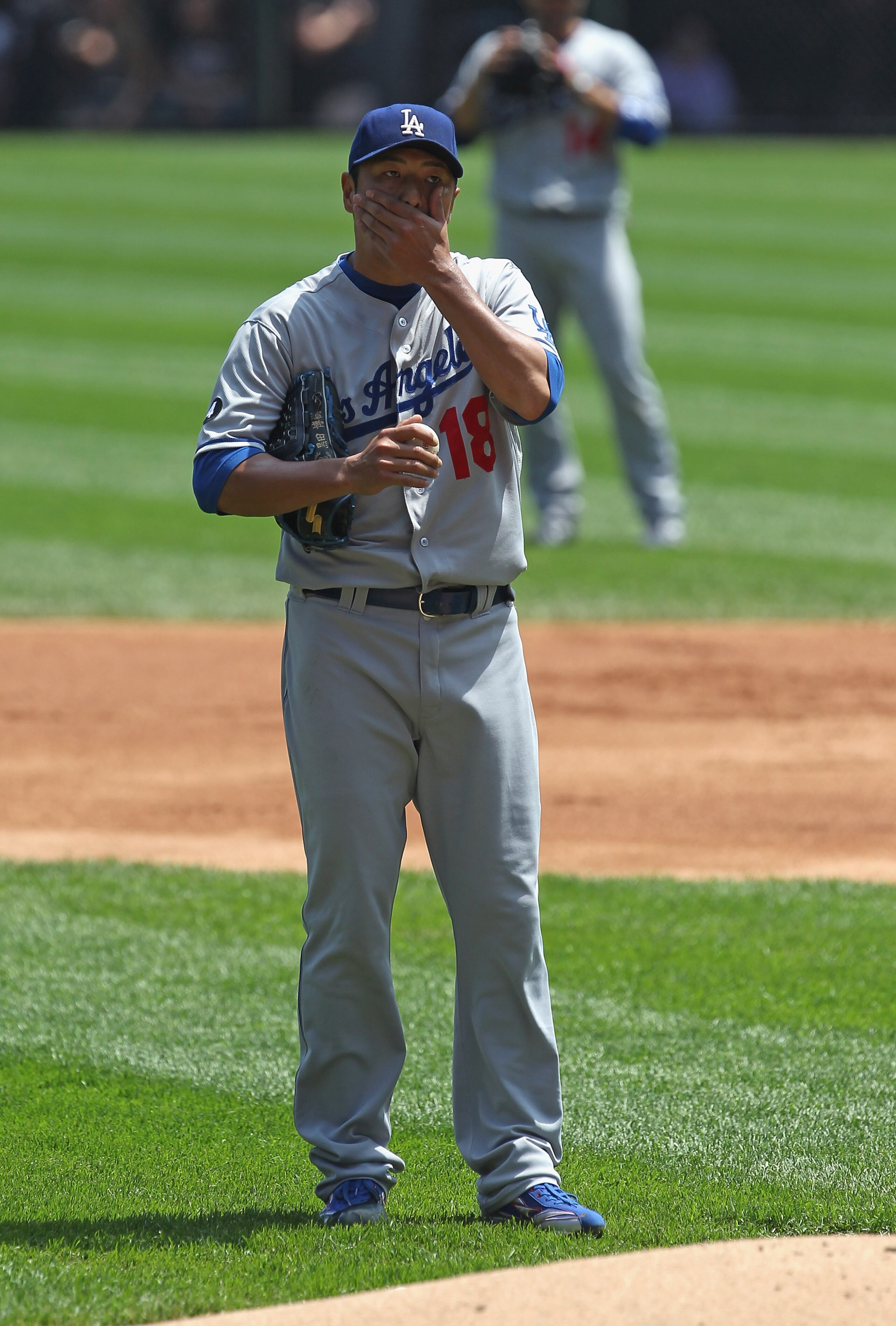 CHICAGO, IL - MAY 22: Starting pitcher Hiroki Kuroda #18 of the Los Angeles Dodgers reacts after giving up a 2nd home run in the 1st inning to the Chicago White Sox at U.S. Cellular Field on May 22, 2011 in Chicago, Illinois. (Photo by Jonathan Daniel/Get
