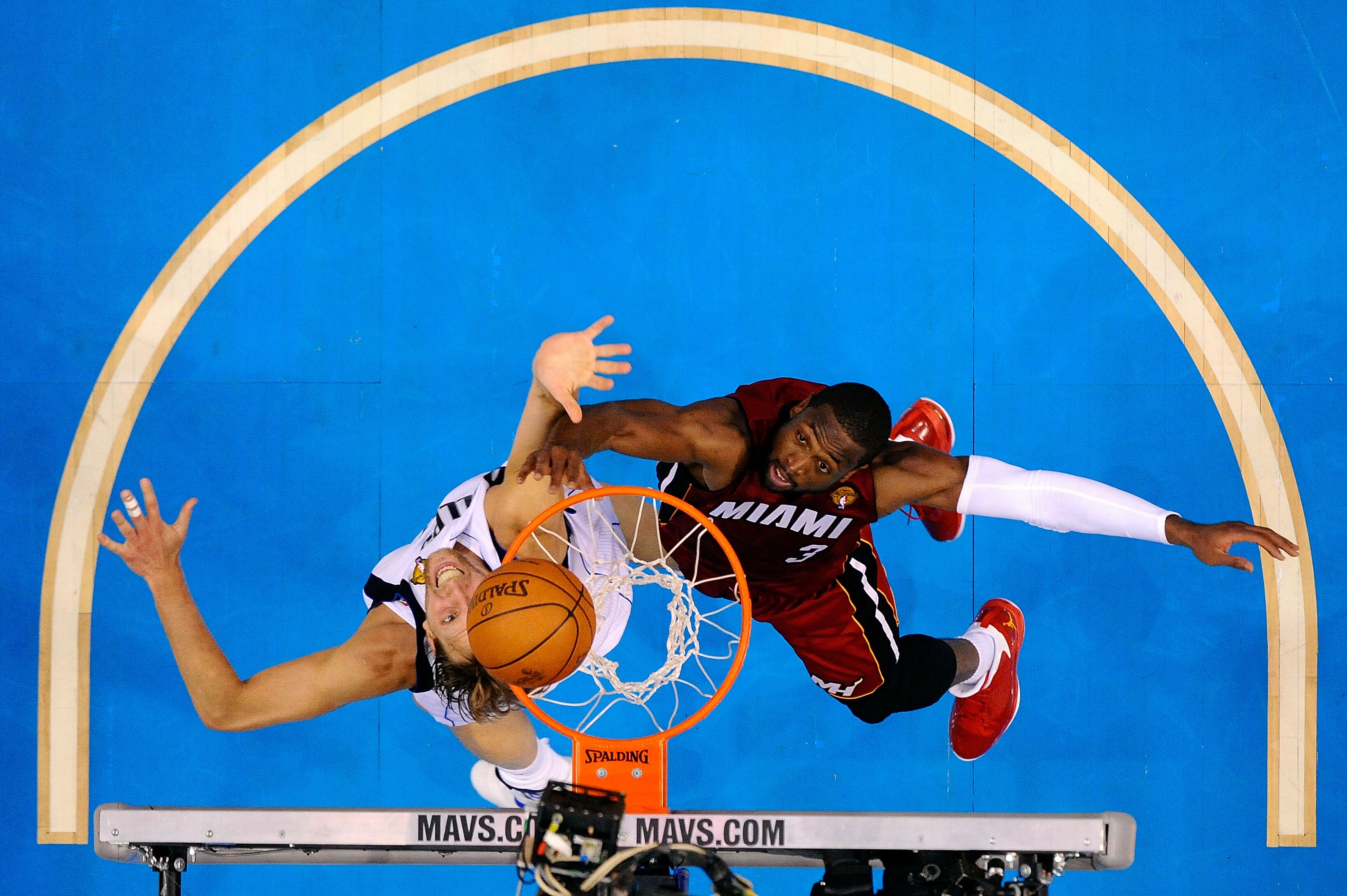 DALLAS, TX - JUNE 05:  Dwyane Wade #3 of the Miami Heat goes up for the ball against Dirk Nowitzki #41 of the Dallas Mavericks in Game Three of the 2011 NBA Finals at American Airlines Center on June 5, 2011 in Dallas, Texas.  NOTE TO USER: User expressly