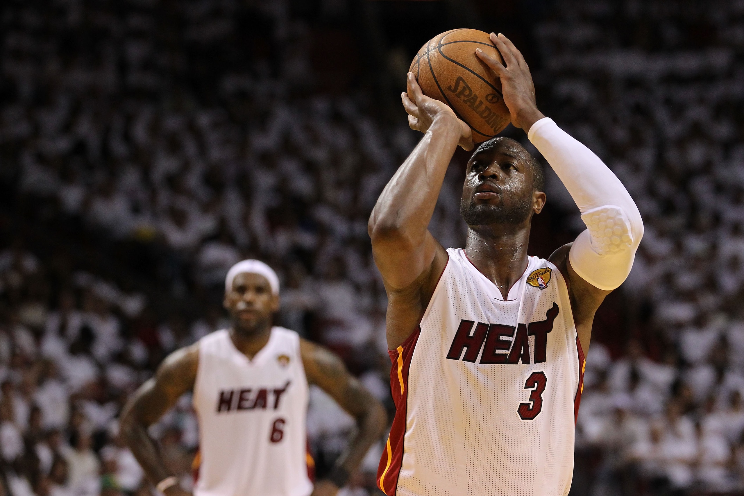MIAMI, FL - MAY 31:  Dwyane Wade #3 of the Miami Heat shoots a free throw while taking on the Dallas Mavericks in Game One of the 2011 NBA Finals at American Airlines Arena on May 31, 2011 in Miami, Florida. NOTE TO USER: User expressly acknowledges and a