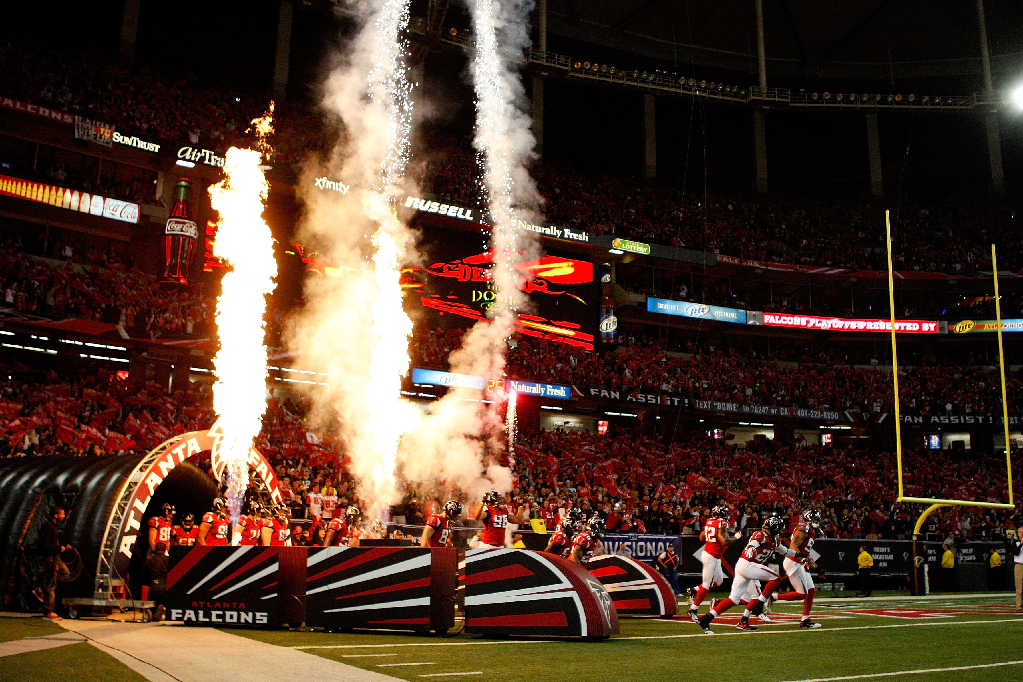 ATLANTA, GA - JANUARY 15:  The Atlanta Falcons run onto the field during pregame festivities against the Green Bay Packers during their 2011 NFC divisional playoff game at Georgia Dome on January 15, 2011 in Atlanta, Georgia.  (Photo by Streeter Lecka/Get