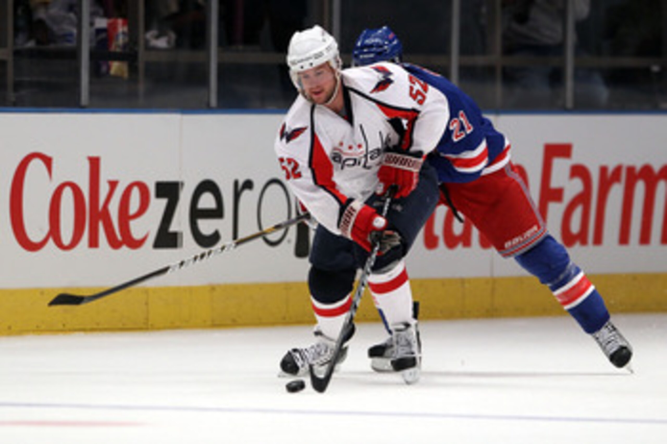NEW YORK, NY - APRIL 17:  Mike Green #52 of the Washington Capitals skates with the puck against the New York Rangers in Game Three of the Eastern Conference Quarterfinals during the 2011 NHL Stanley Cup Playoffs at Madison Square Garden on April 17, 2011