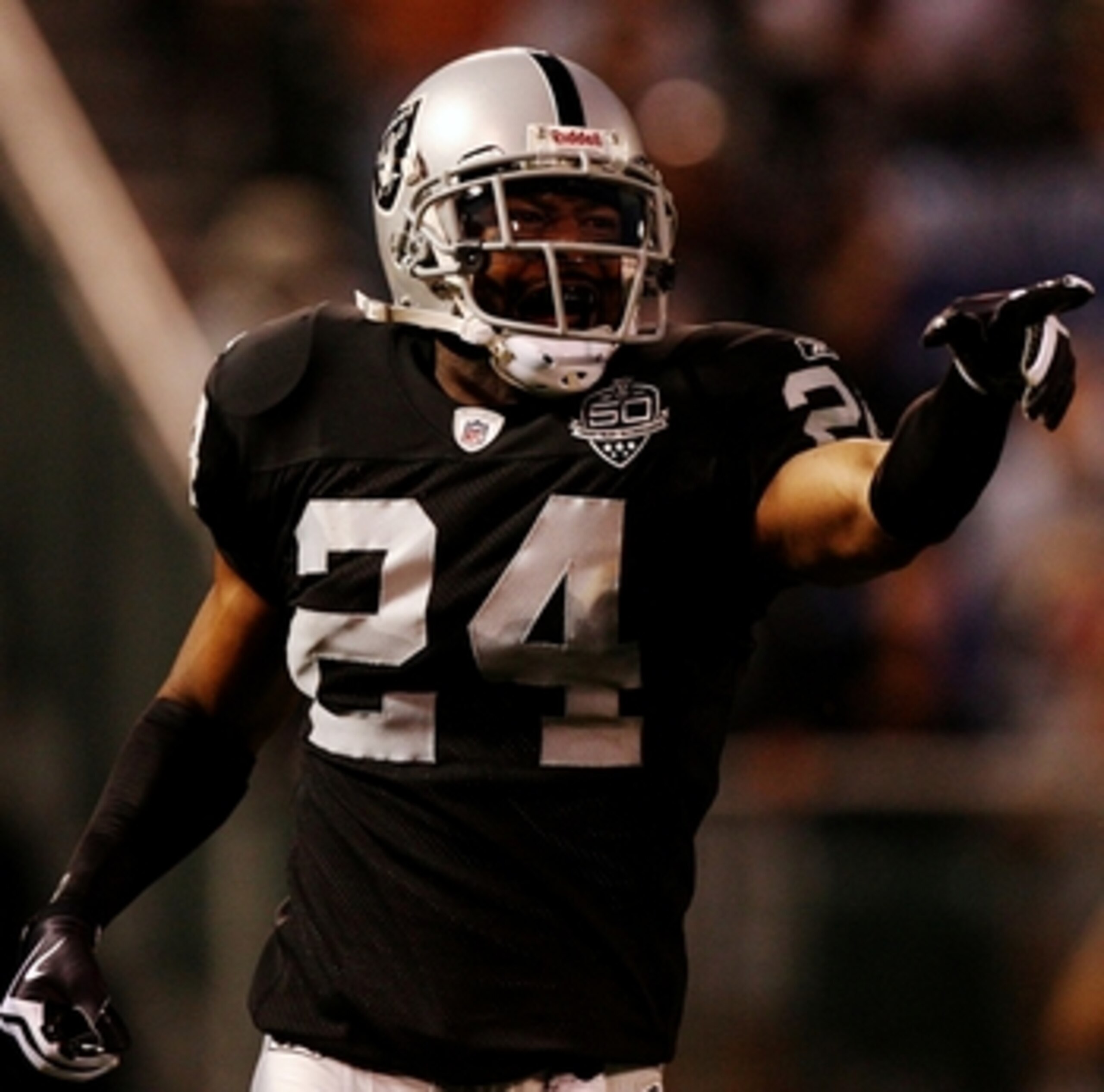 OAKLAND, CA - AUGUST 13:  Safety Michael Huff #24 of the Oakland Raiders celebrates after making an interception against the Dallas Cowboys during the preseason game at Oakland-Alameda County Coliseum on August 13, 2009 in Oakland, California. (Photo by J