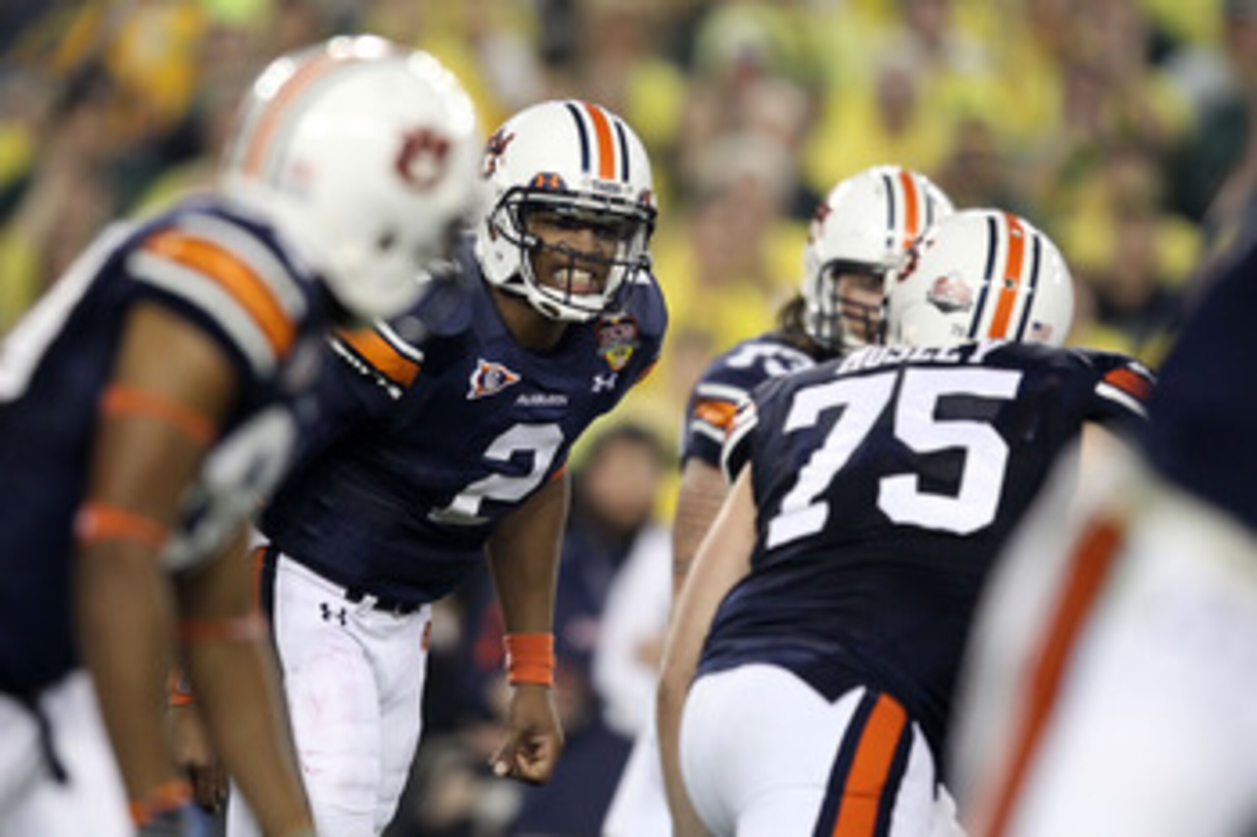 GLENDALE, AZ - JANUARY 10:  Cameron Newton #2 of the Auburn Tigersc reacts with his team against the Oregon Ducks during the Tostitos BCS National Championship Game at University of Phoenix Stadium on January 10, 2011 in Glendale, Arizona.  (Photo by Chri