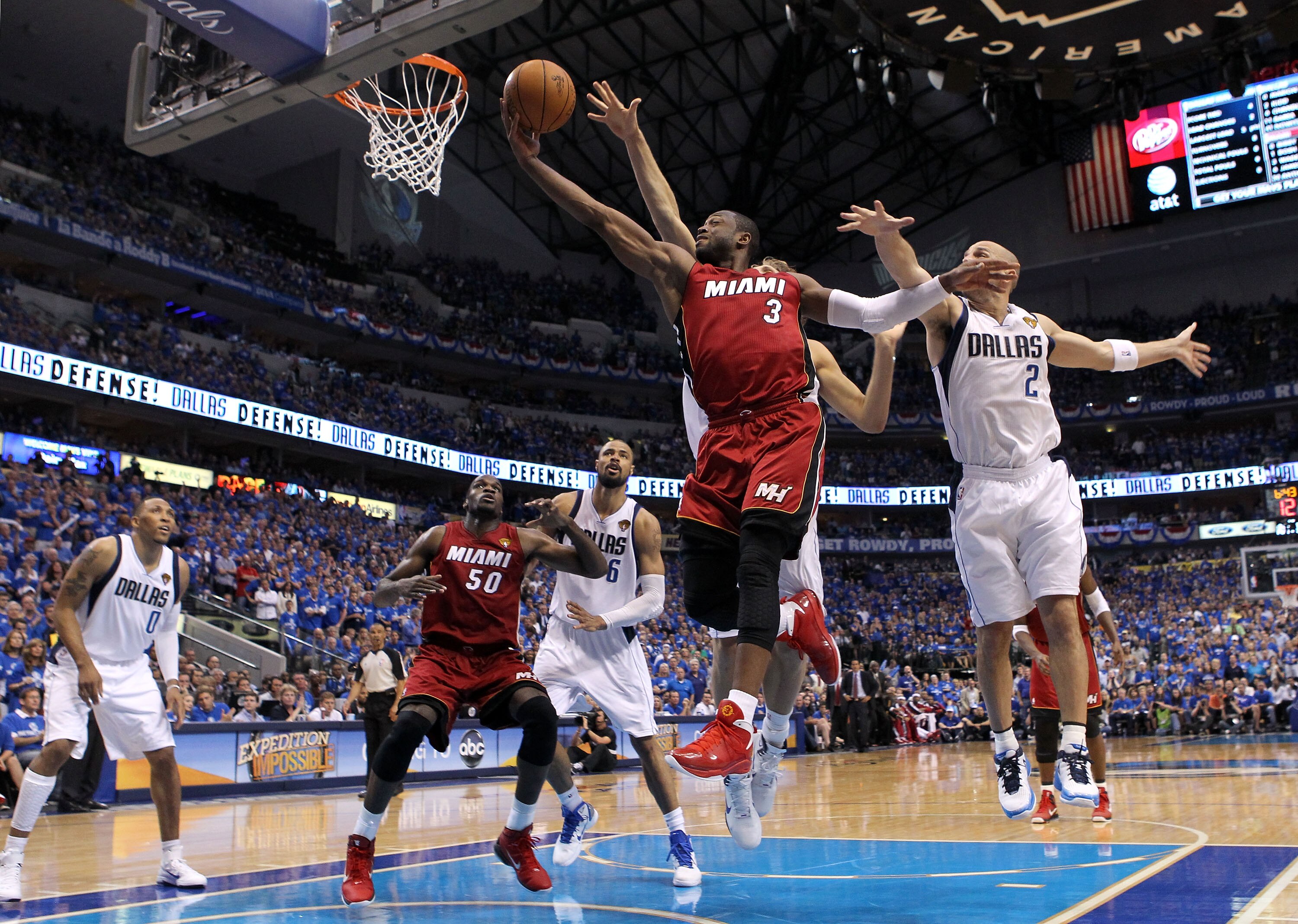 DALLAS, TX - JUNE 05:  Dwyane Wade #3 of the Miami Heat goes up for a shot between Dirk Nowitzki #41 and Jason Kidd #2 of the Dallas Mavericks in the third quarter in Game Three of the 2011 NBA Finals at American Airlines Center on June 5, 2011 in Dallas,