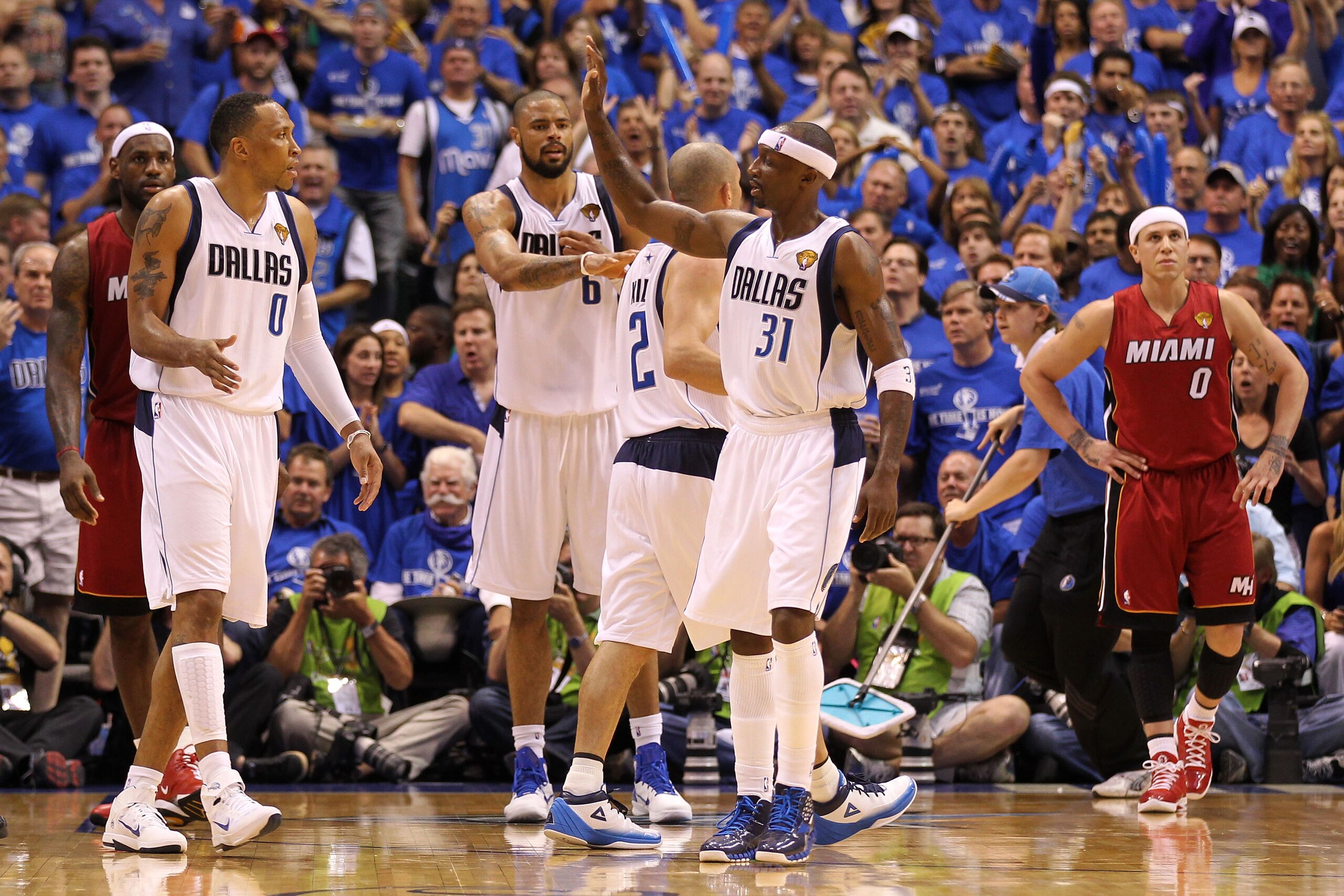 DALLAS, TX - JUNE 05:  Shawn Marion #0, Tyson Chandler #6 and Jason Terry #31 of the Dallas Mavericks react against LeBron James #6 (L) and Mike Bibby #0 of the Miami Heat in Game Three of the 2011 NBA Finals at American Airlines Center on June 5, 2011 in