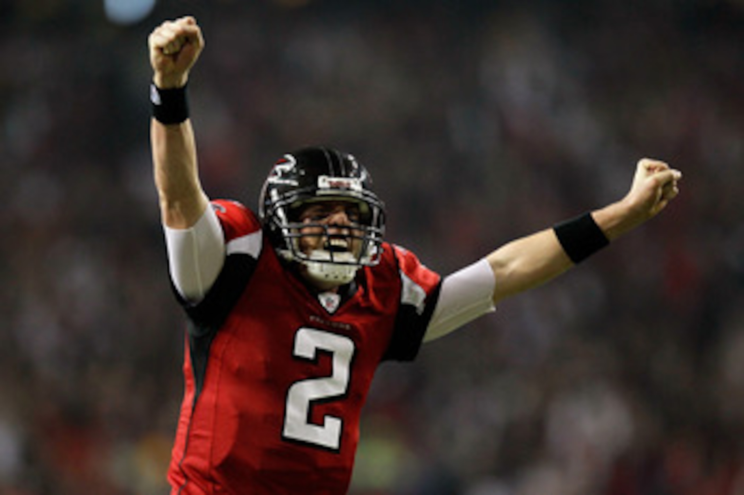 ATLANTA, GA - JANUARY 15:  Matt Ryan #2 of the Atlanta Falcons reacts after Michael Turner #33 scored a 12-yard rushing touchdown in the first quarter against the Green Bay Packers during their 2011 NFC divisional playoff game at Georgia Dome on January 1
