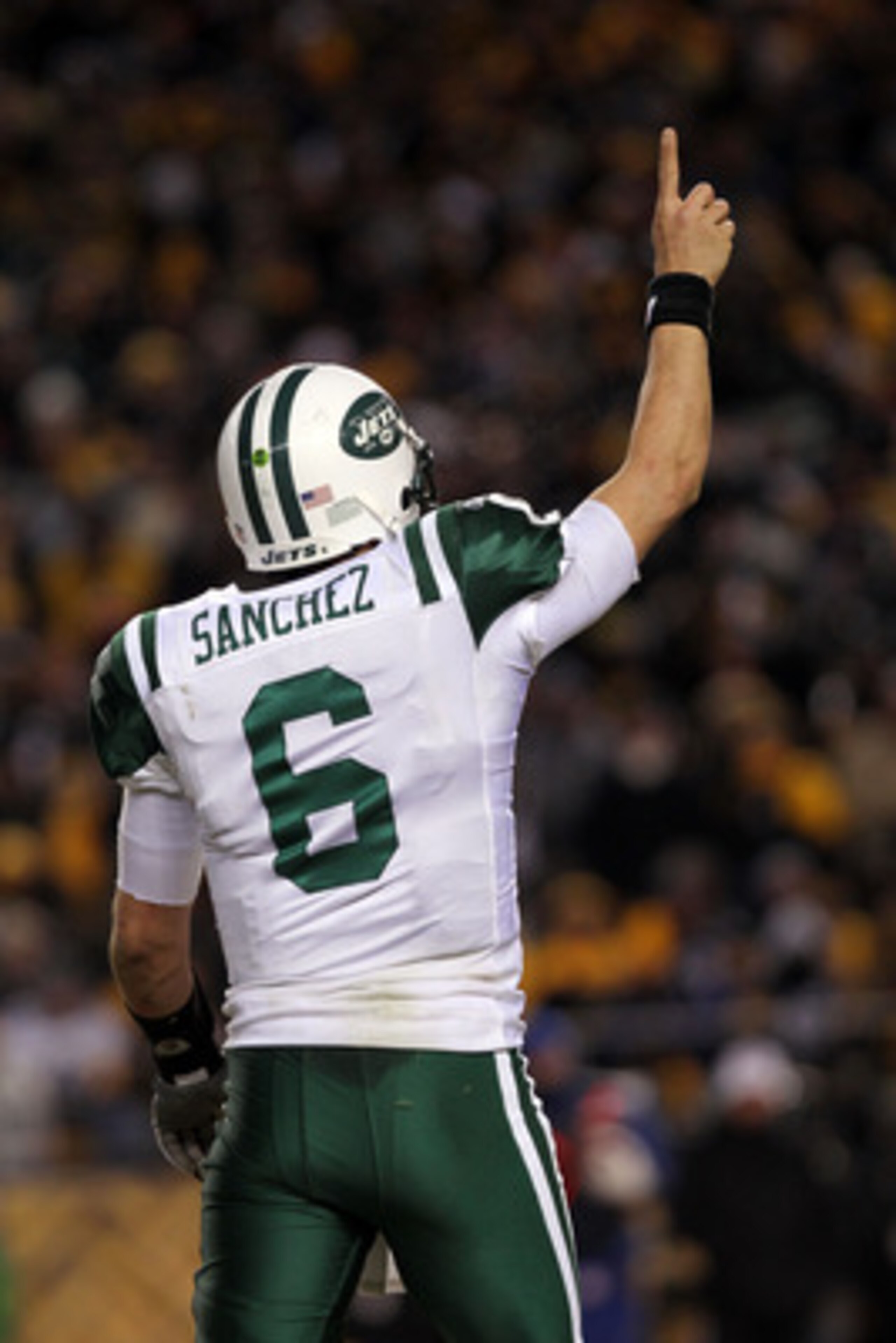 PITTSBURGH, PA - JANUARY 23:  Quarterback Mark Sanchez #6 of the New York Jets gestures after he threw a touchdown pas against the Pittsburgh Steelers during the 2011 AFC Championship game at Heinz Field on January 23, 2011 in Pittsburgh, Pennsylvania. Th