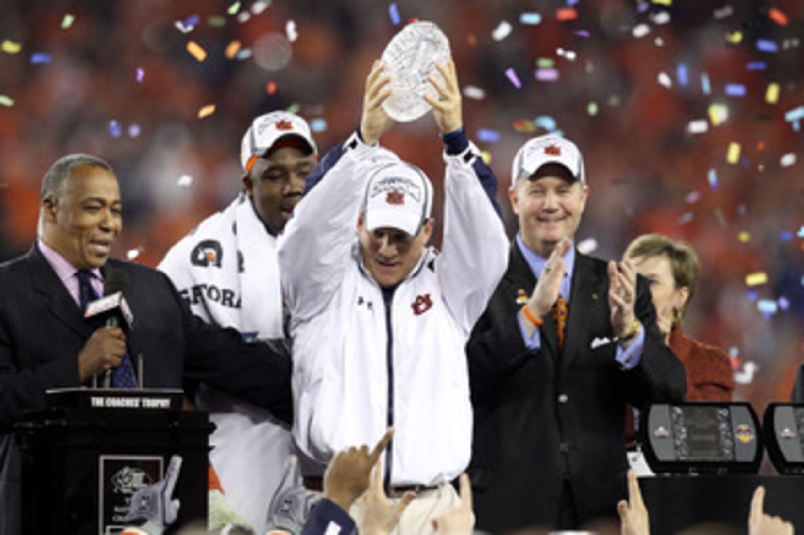 GLENDALE, AZ - JANUARY 10:  Head coach Gene Chizik of the Auburn Tigers celebrates the Tigers 22-19 victory against the Oregon Ducks during the Tostitos BCS National Championship Game at University of Phoenix Stadium on January 10, 2011 in Glendale, Arizo