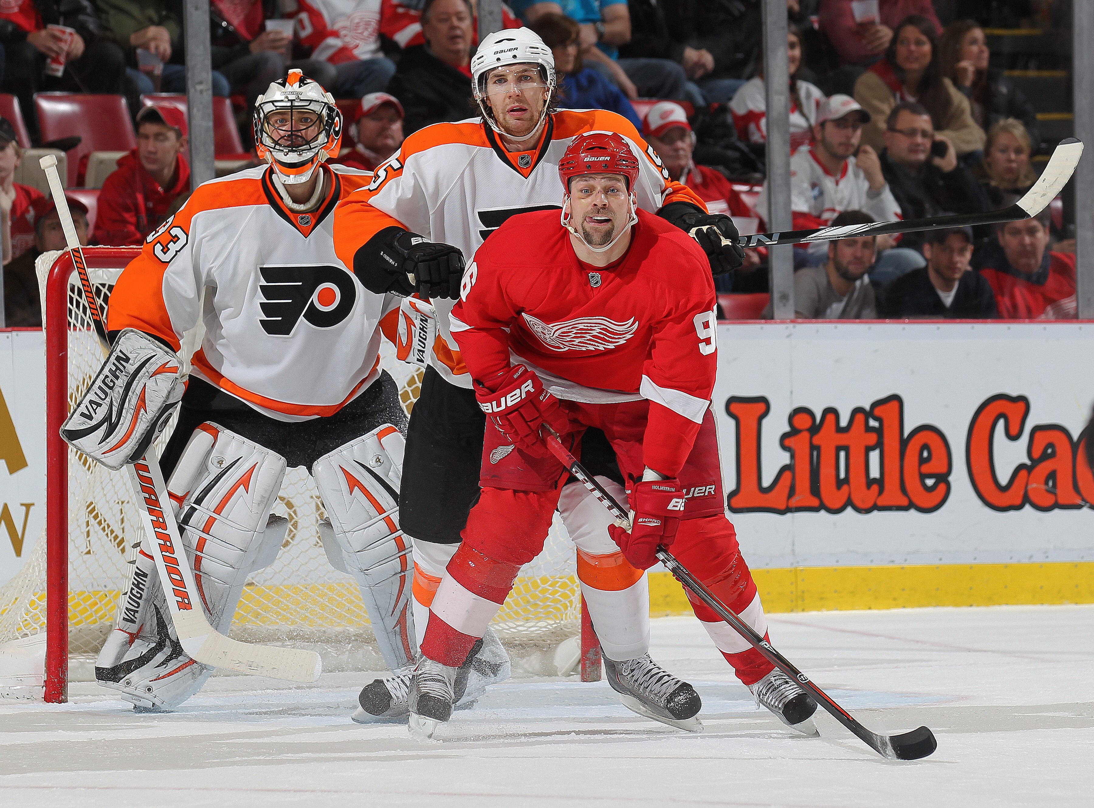 DETROIT, MI - JANUARY 2: Brayden Coburn #5 of the Philadelphia Flyers gives Tomas Holmstrom #96 of the Detroit Red Wings a shot in the back in a game on January 2, 2011 at the Joe Louis Arena in Detroit, Michigan. The Flyers defeated the Wings 3-2. (Phot DETROIT, MI - JANUARY 2: Brayden Coburn #5 of the Philadelphia Flyers gives Tomas Holmstrom #96 of the Detroit Red Wings a shot in the back in a game on January 2, 2011 at the Joe Louis Arena in Detroit, Michigan. The Flyers defeated the Wings 3-2. (Phot
