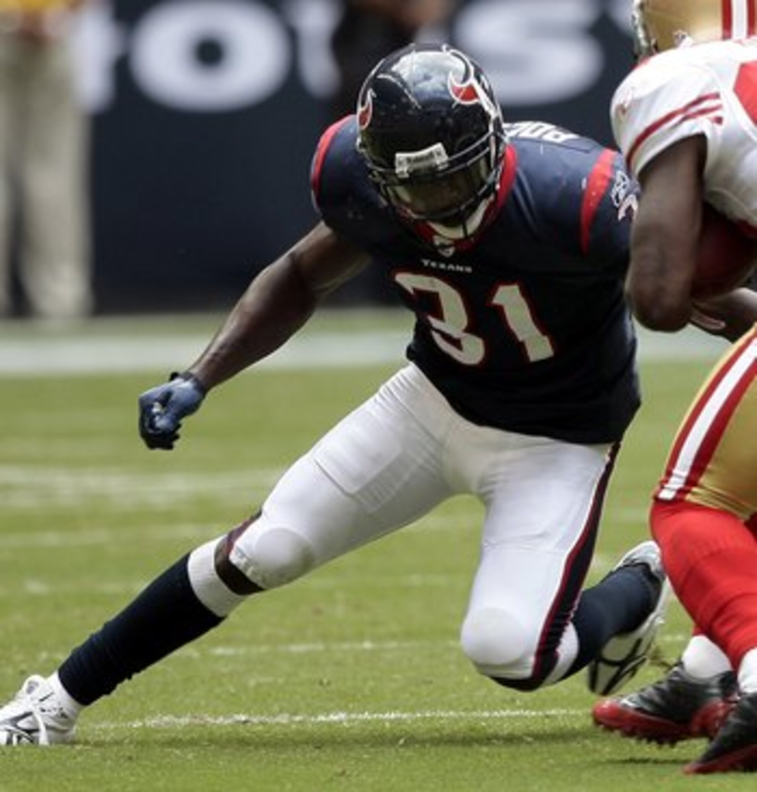 HOUSTON - OCTOBER 25:  Wide receiver Josh Morgan #84 of the San Francisco 49ers is tripped up by short safety Bernard Pollard #31 of the Houston Texans at Reliant Stadium on October 25, 2009 in Houston, Texas.  (Photo by Bob Levey/Getty Images)