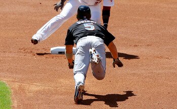 HOUSTON - MAY 14:  David Wright #5 of the New York Mets steals second base as secnd baseman Bill Hall is late on the tag at Minute Maid Park on May 14, 2011 in Houston, Texas.  (Photo by Bob Levey/Getty Images)