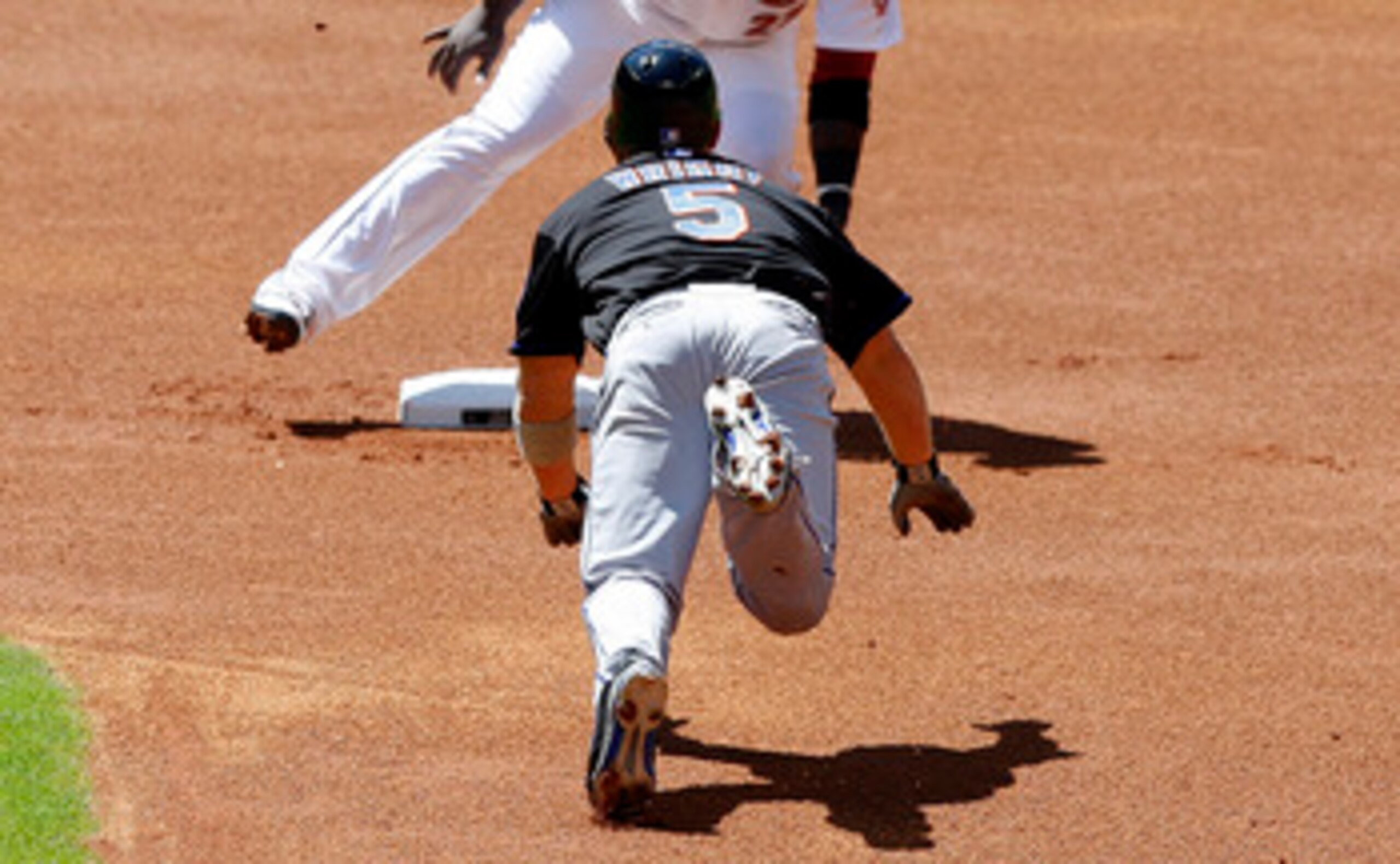 HOUSTON - MAY 14:  David Wright #5 of the New York Mets steals second base as secnd baseman Bill Hall is late on the tag at Minute Maid Park on May 14, 2011 in Houston, Texas.  (Photo by Bob Levey/Getty Images)