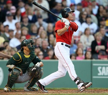 BOSTON, MA - JUNE 03: Jacoby Ellsbury #2 of the Boston Red Sox gets a hit in the first inning as Kurt Suzuki #8 of the Oakland Athletics defends on June 3, 2011 at Fenway Park in Boston, Massachusetts.  (Photo by Elsa/Getty Images)