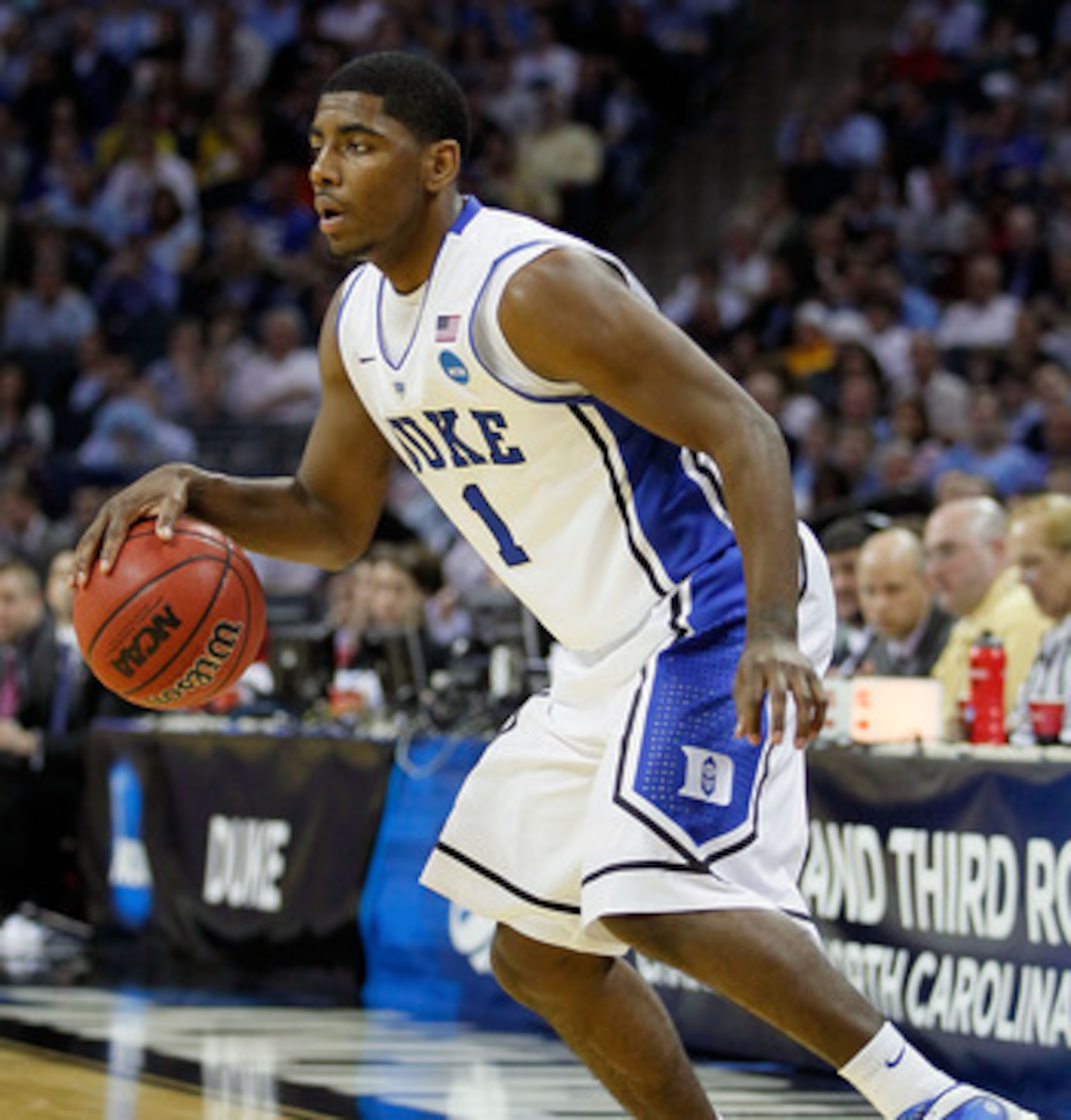 CHARLOTTE, NC - MARCH 20: Kyrie Irving #1 of the Duke Blue Devils moves the ball while taking on the Michigan Wolverines during the third round of the 2011 NCAA men's basketball tournament at Time Warner Cable Arena on March 20, 2011 in Charlotte, North CHARLOTTE, NC - MARCH 20: Kyrie Irving #1 of the Duke Blue Devils moves the ball while taking on the Michigan Wolverines during the third round of the 2011 NCAA men's basketball tournament at Time Warner Cable Arena on March 20, 2011 in Charlotte, North