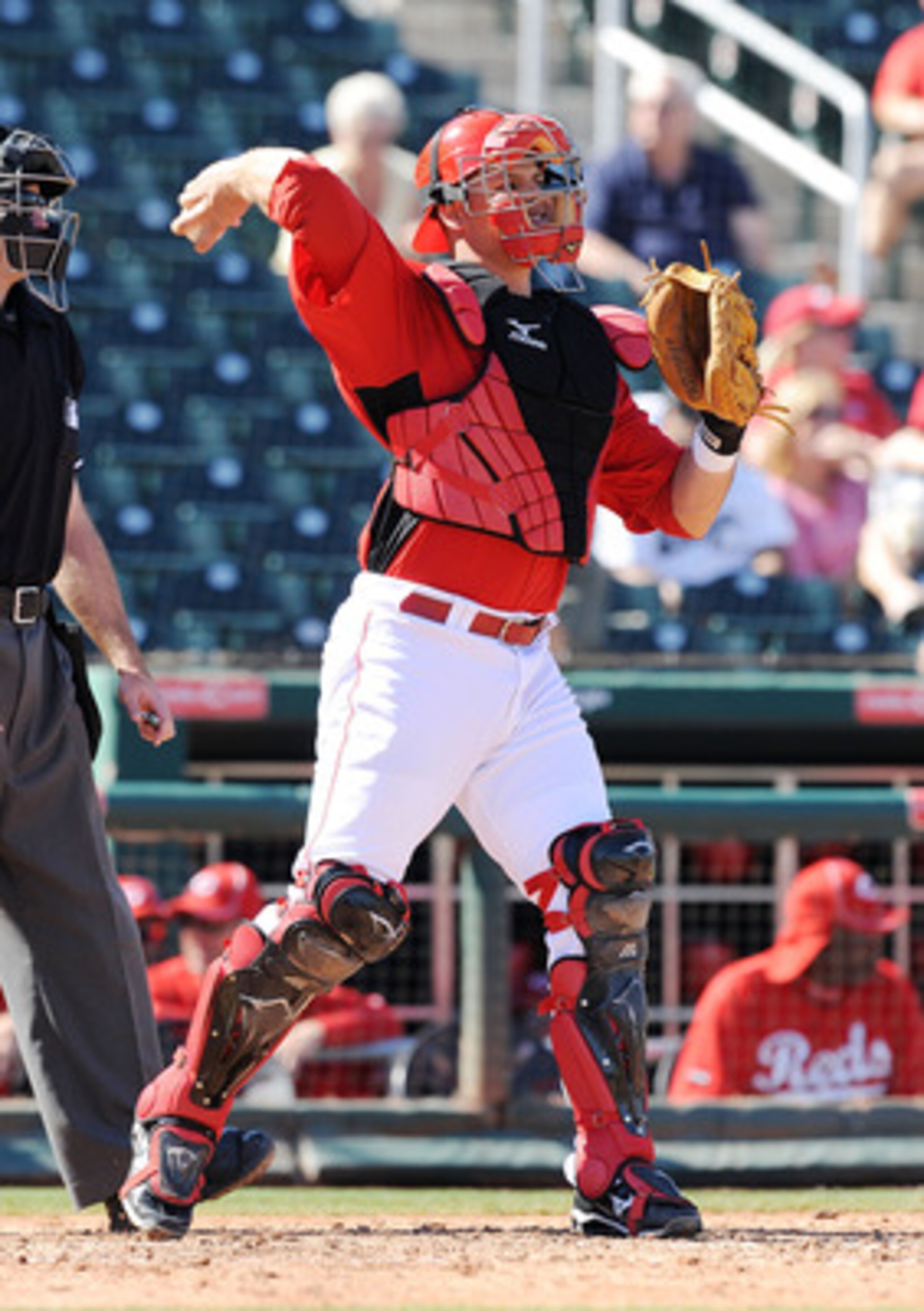 GOODYEAR, AZ - MARCH 02:  Devin Mesoraco #65 of the Cincinnati Reds throws the ball back to the pitcher during warm ups agianst the Chicago White Sox during a spring training game at Goodyear Ballpark on March 2, 2011 in Goodyear, Arizona.  (Photo by Norm